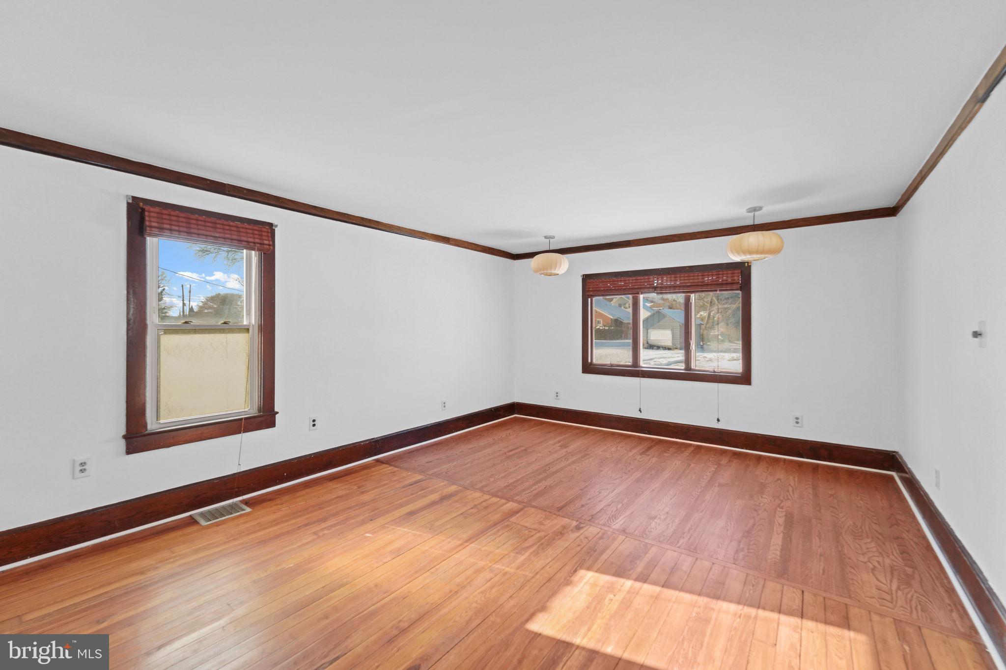 200 Union Street Salem, NJ 08079 - Photo 20 of 43 a view of an empty room with window and wooden floor