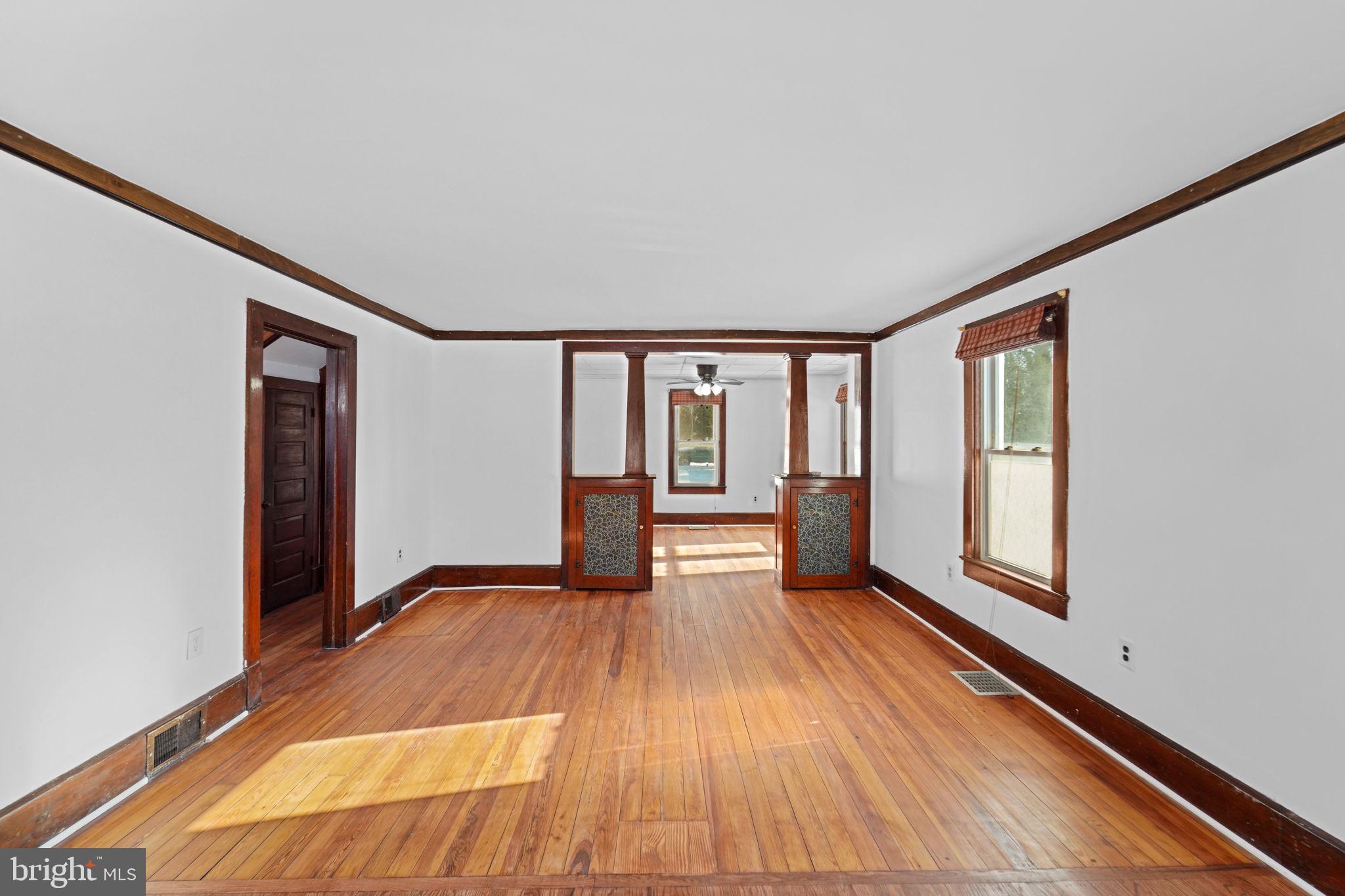 200 Union Street Salem, NJ 08079 - Photo 22 of 43 a view of empty room with wooden floor and fan