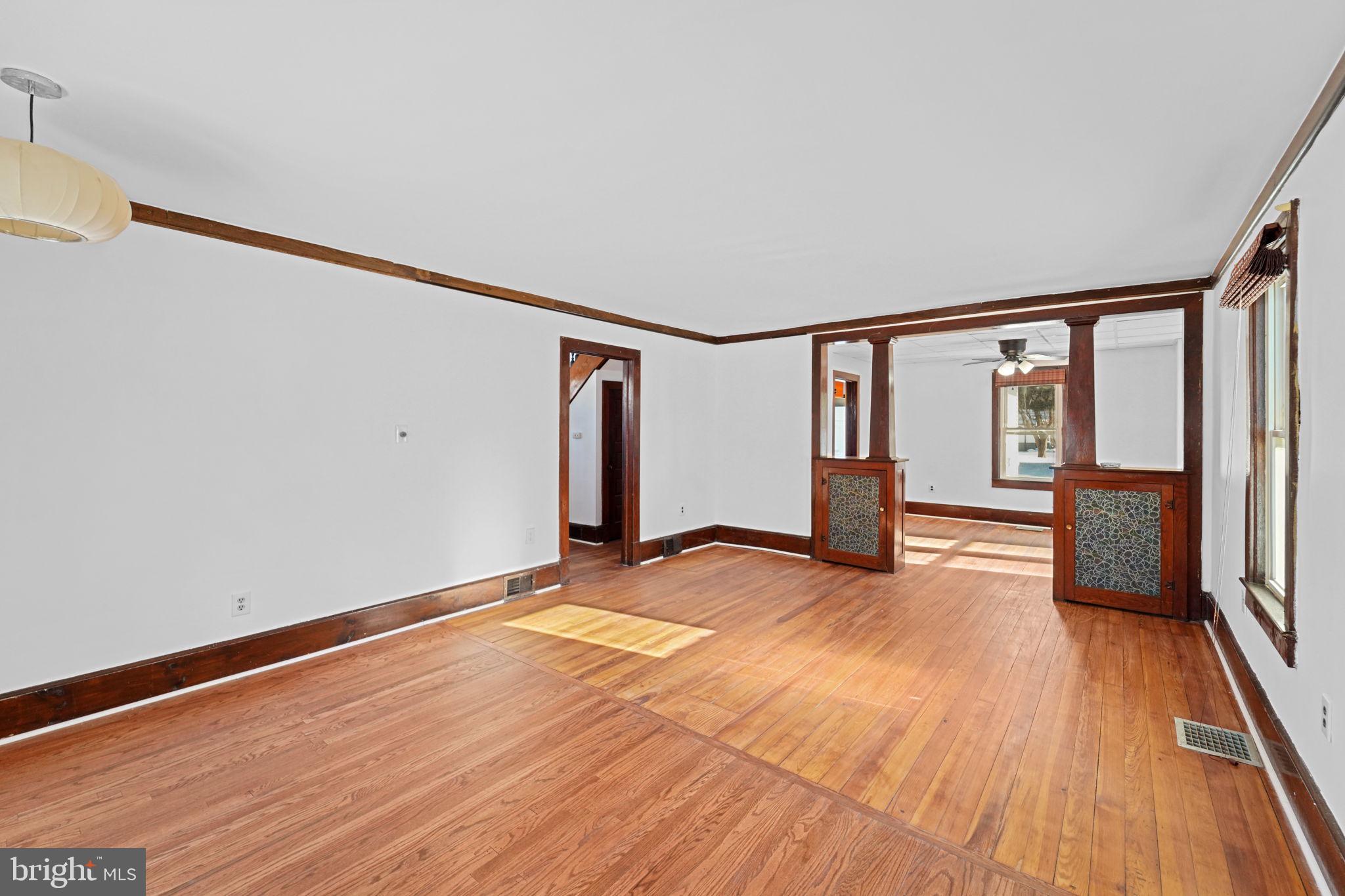 200 Union Street Salem, NJ 08079 - Photo 23 of 43 a view of empty room with wooden floor and fan