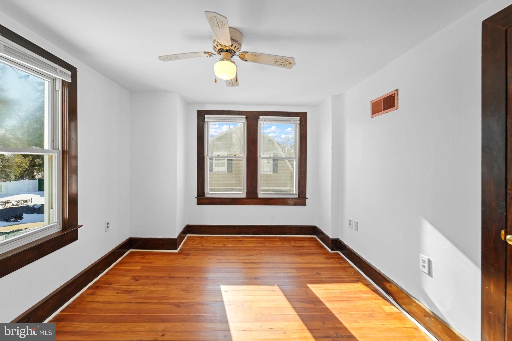 200 Union Street Salem, NJ 08079 - Photo 27 of 43 a view of a room with wooden floor and window