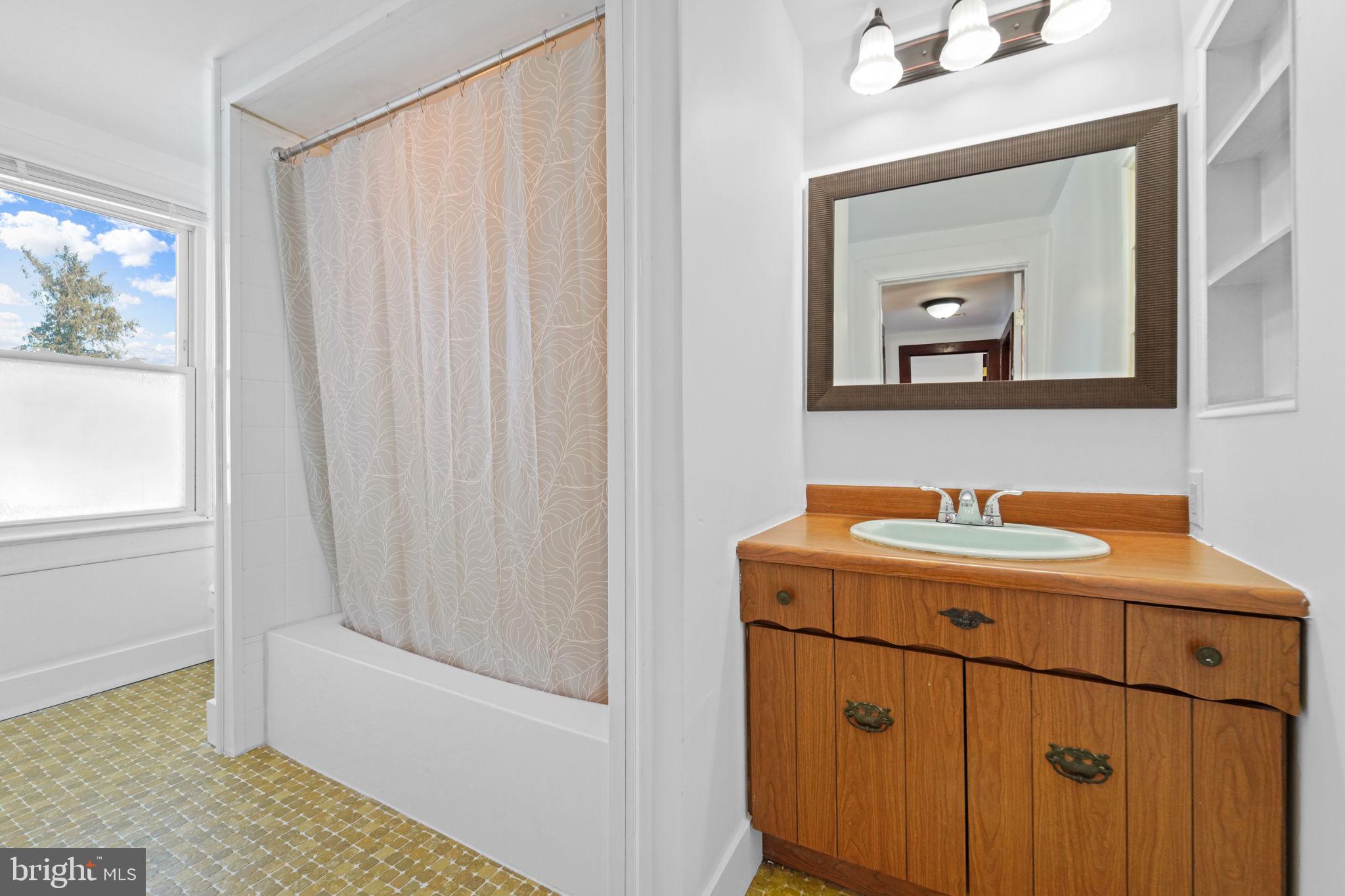 200 Union Street Salem, NJ 08079 - Photo 29 of 43 a bathroom with a sink a vanity and a mirror