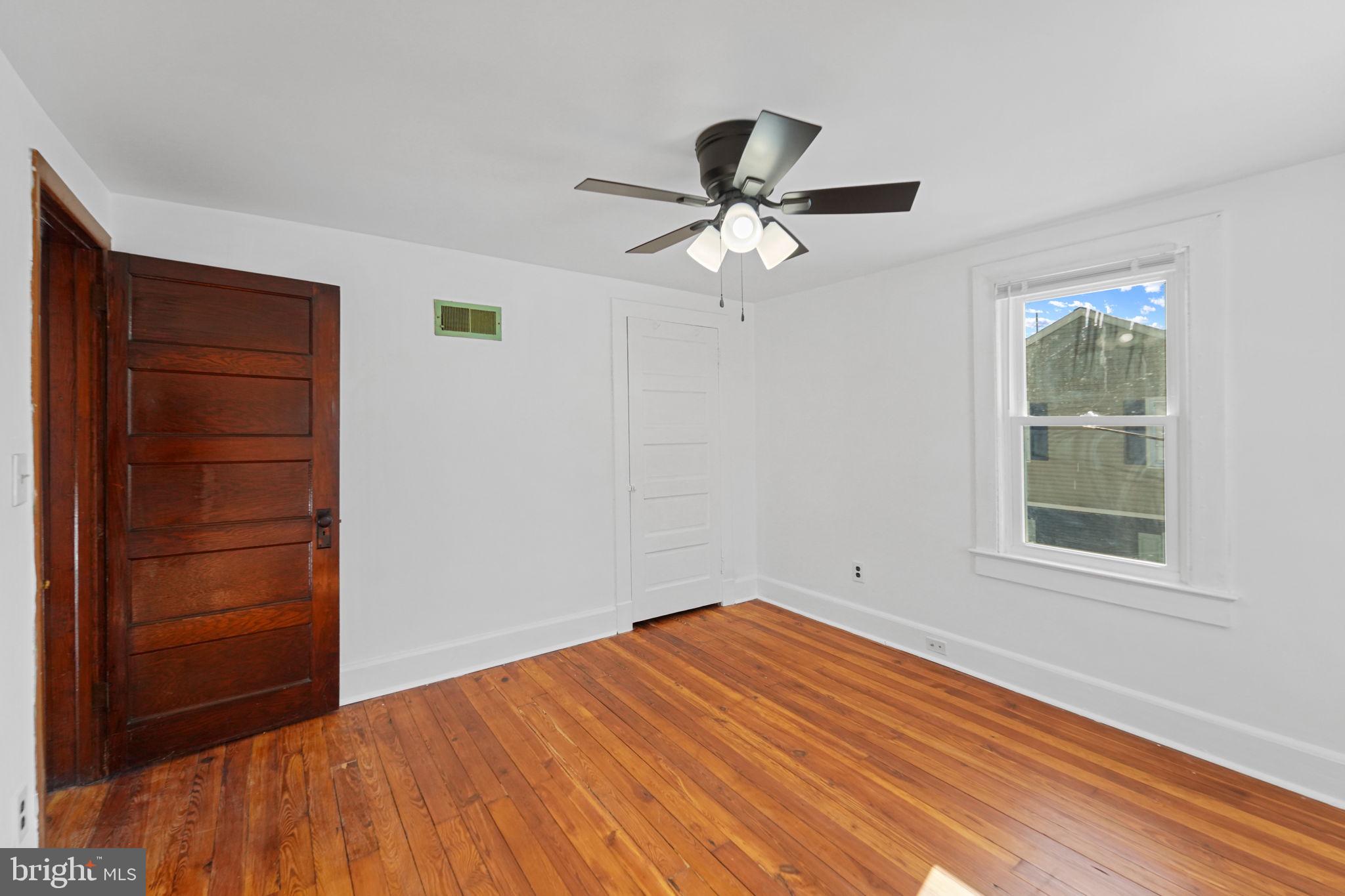 200 Union Street Salem, NJ 08079 - Photo 32 of 43 an empty room with windows and closet