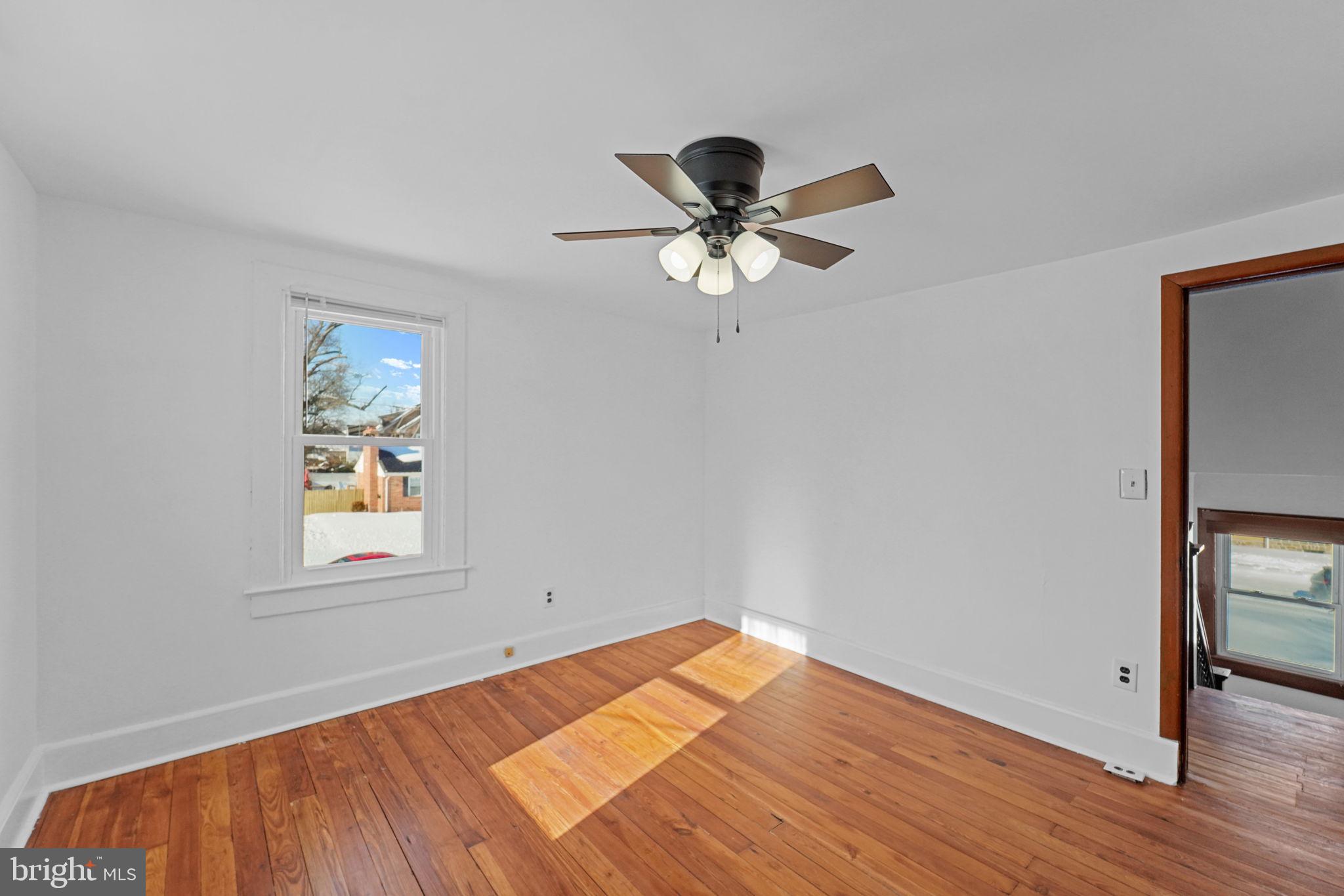 200 Union Street Salem, NJ 08079 - Photo 33 of 43 a view of an empty room window and wooden floor