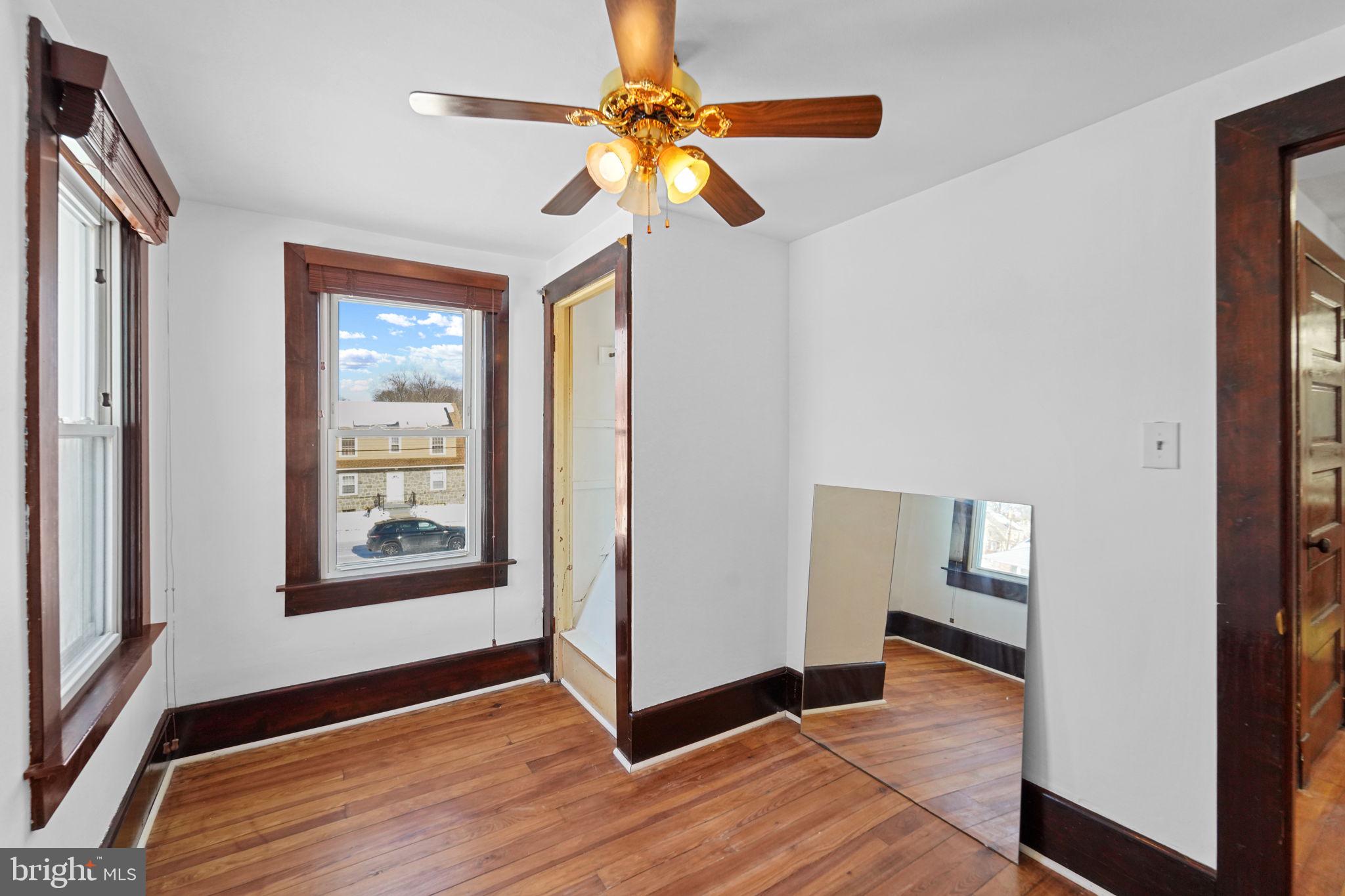 200 Union Street Salem, NJ 08079 - Photo 34 of 43 a view of an empty room with window and wooden floor