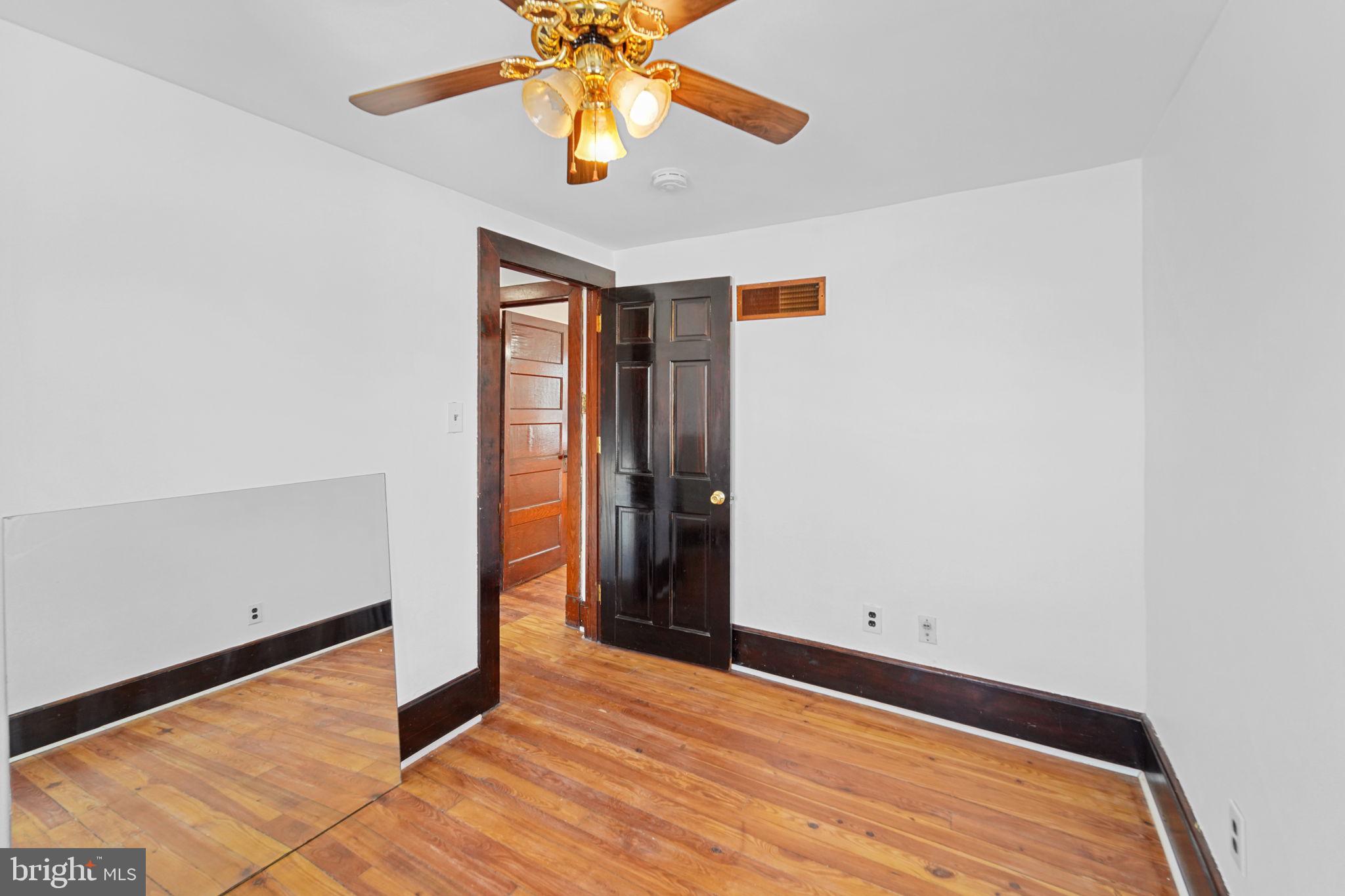 200 Union Street Salem, NJ 08079 - Photo 36 of 43 an empty room with a ceiling fan and carpet