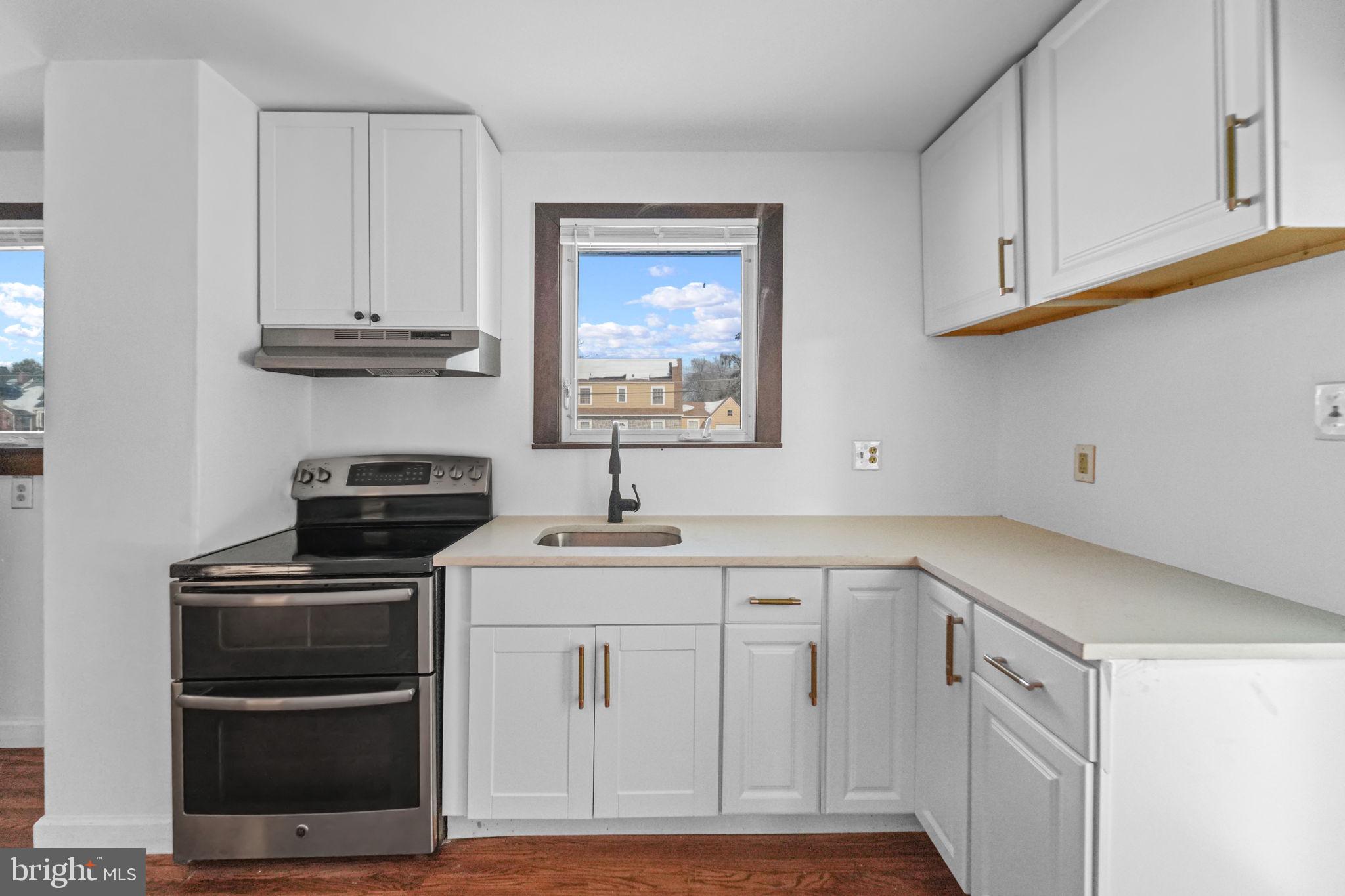 200 Union Street Salem, NJ 08079 - Photo 7 of 43 a kitchen with white cabinets and appliances