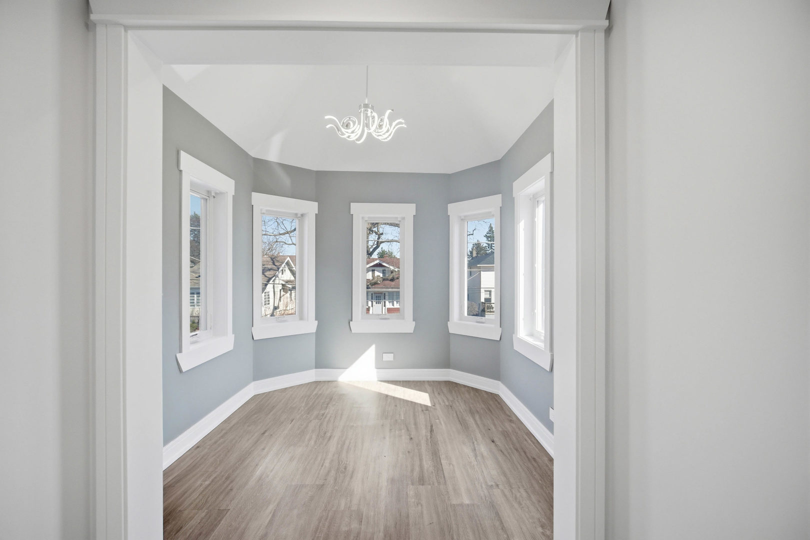 1020 Hill Avenue Elgin, IL 60120 - Photo 14 of 43 an empty room with wooden floor and windows