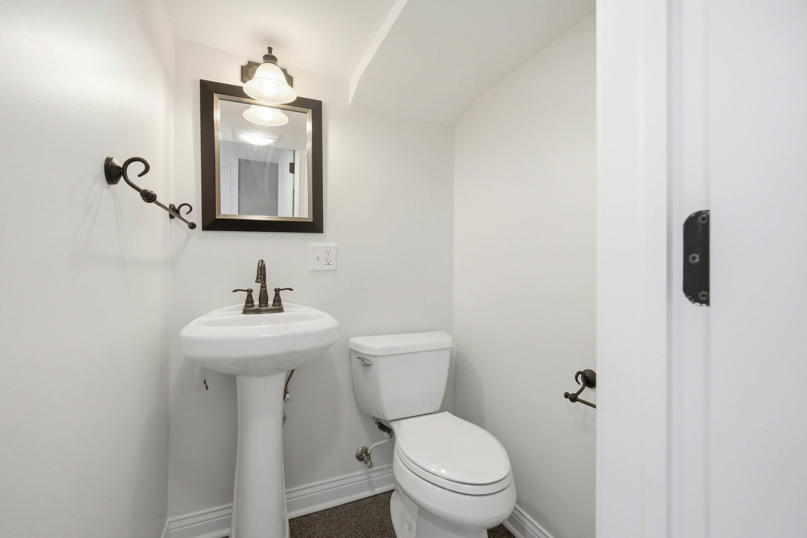 1020 Hill Avenue Elgin, IL 60120 - Photo 25 of 43 a bathroom with a toilet a sink and mirror