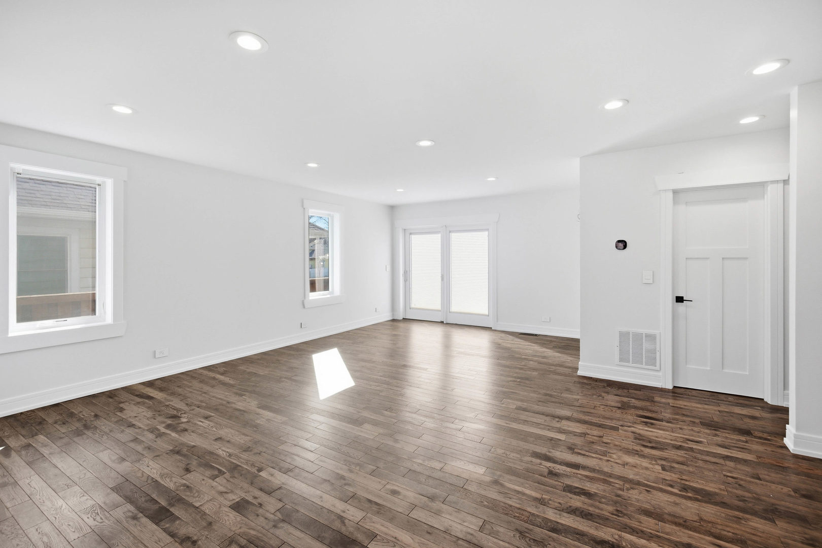 1020 Hill Avenue Elgin, IL 60120 - Photo 4 of 43 a view of empty room with wooden floor and windows