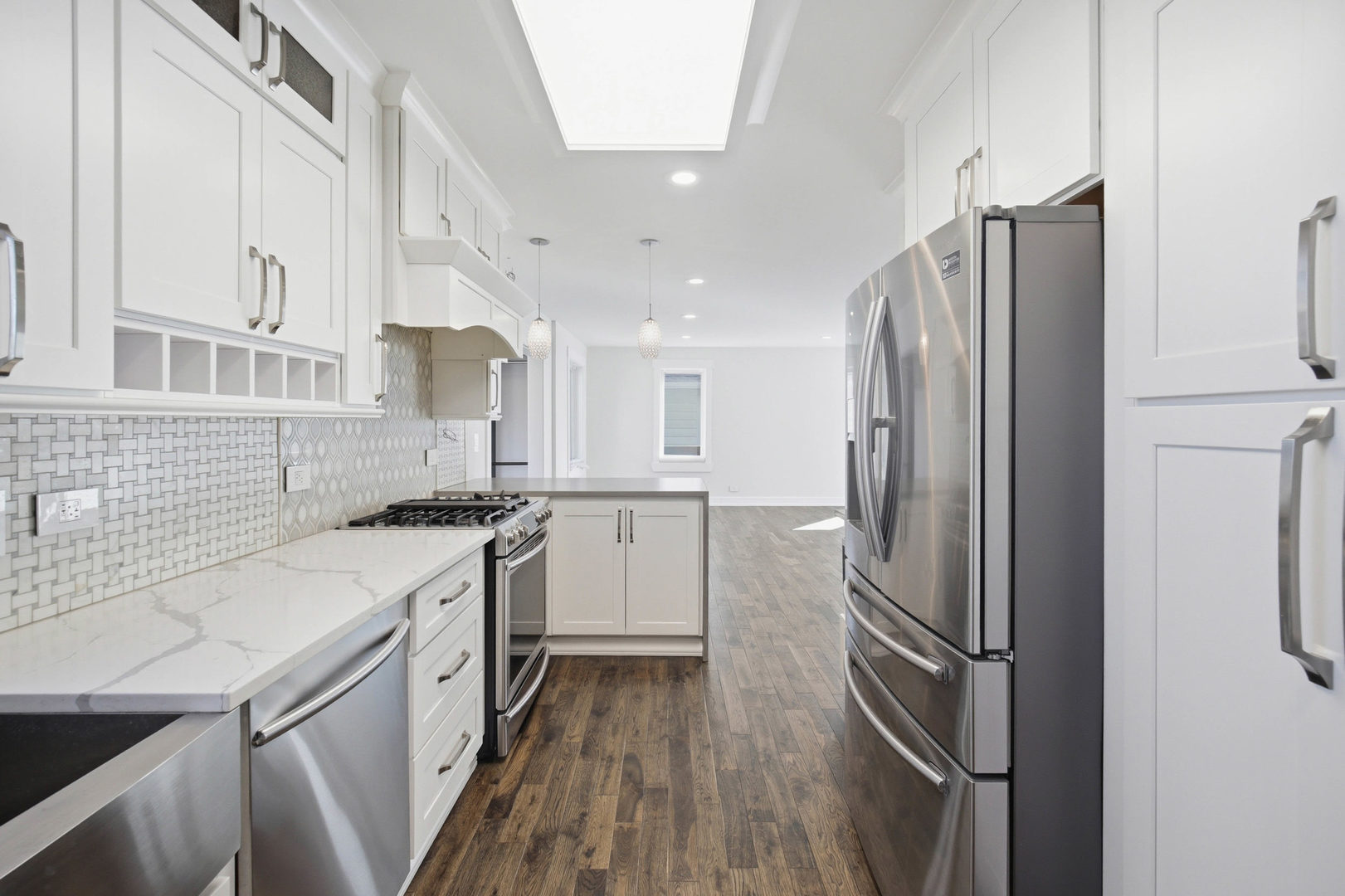 1020 Hill Avenue Elgin, IL 60120 - Photo 7 of 43 a kitchen with stainless steel appliances a refrigerator sink and stove