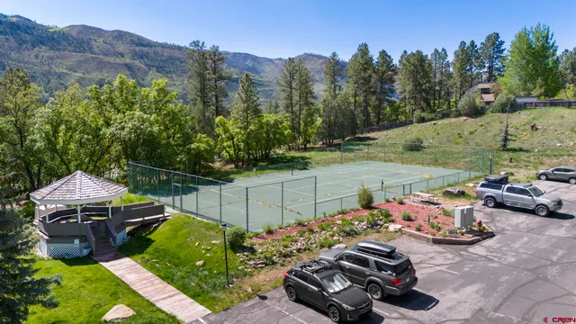 a view of a backyard with sitting area