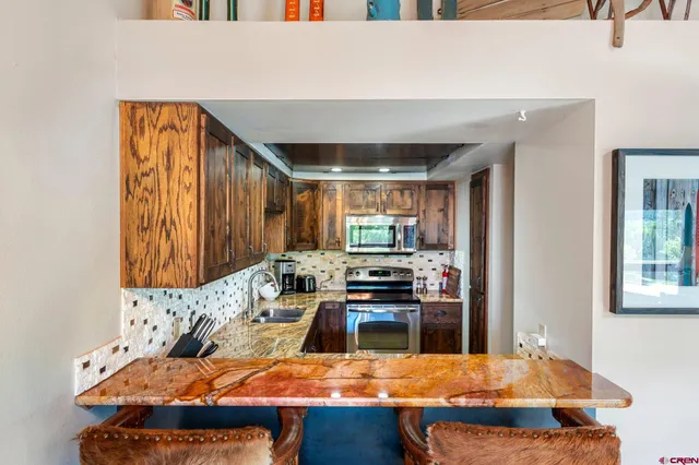 a room with furniture and a flat screen tv