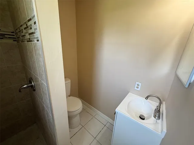 a bathroom with a sink and toilet