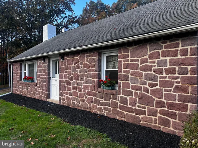 a view of house with backyard