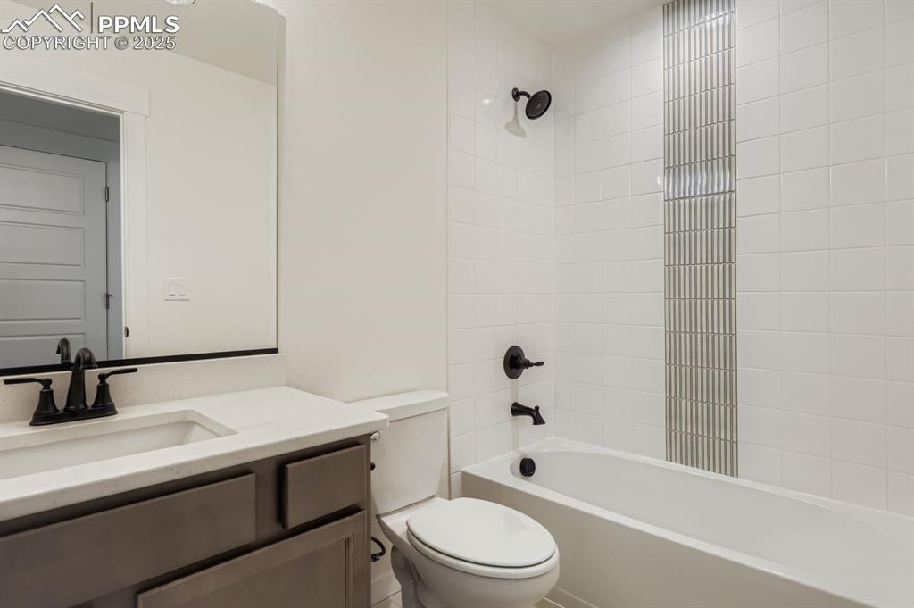 7989 Polson Drive Colorado Springs, CO 80908 - Photo 20 of 28 Bathroom with vanity and bathtub / shower combination