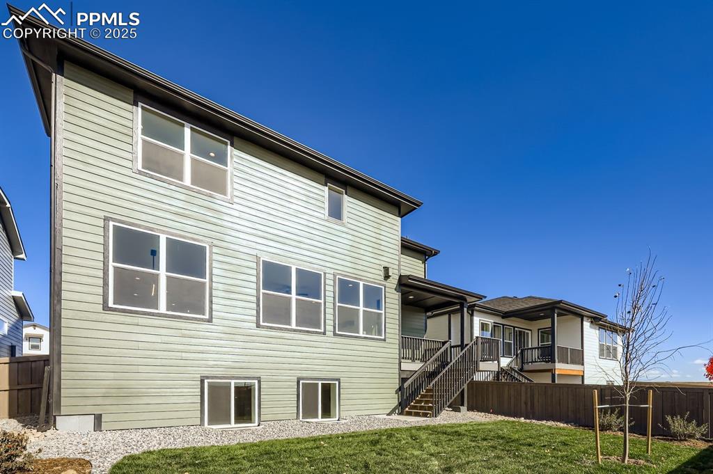 7989 Polson Drive Colorado Springs, CO 80908 - Photo 27 of 28 Back of house with stairs