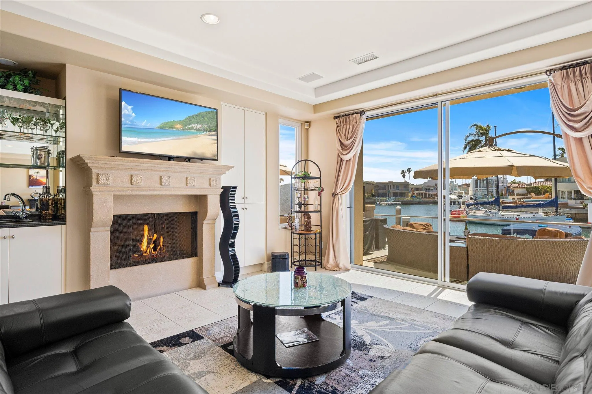 24 Sandpiper Strand Coronado, CA 92118 - Photo 1 of 55 a living room with furniture and a fireplace