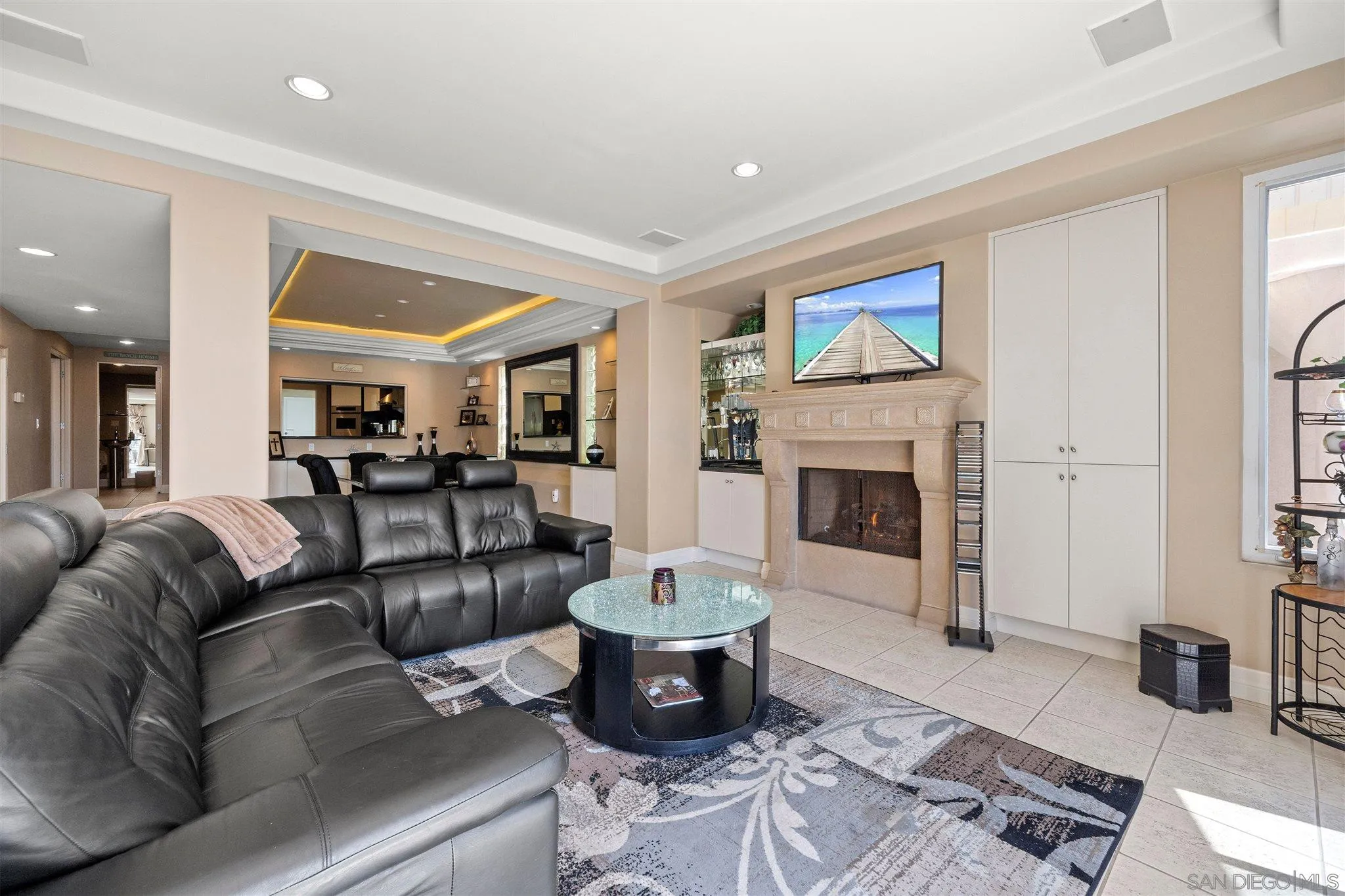 24 Sandpiper Strand Coronado, CA 92118 - Photo 19 of 55 a living room with furniture and a fireplace