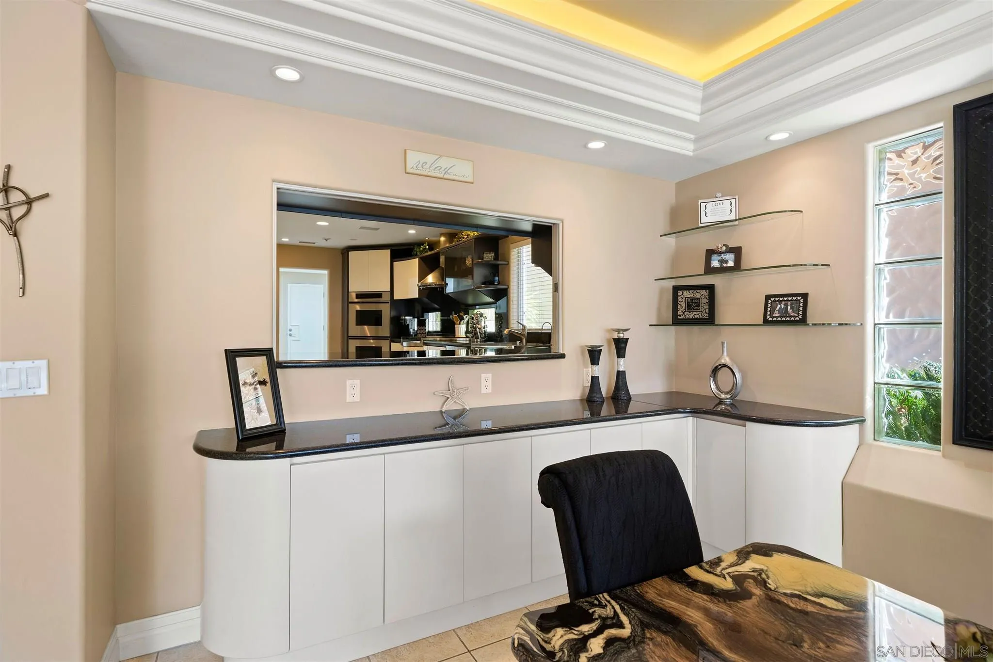 24 Sandpiper Strand Coronado, CA 92118 - Photo 23 of 55 a dining room with table and chairs