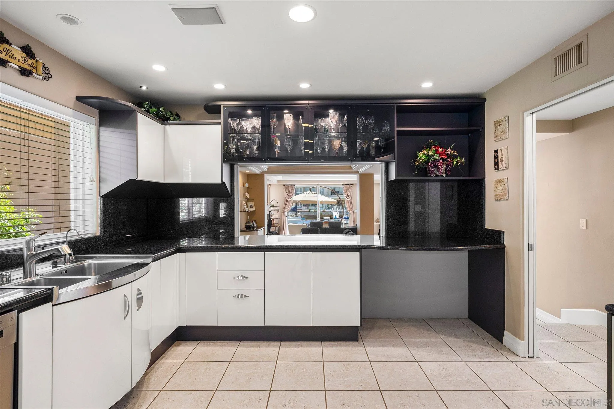 24 Sandpiper Strand Coronado, CA 92118 - Photo 25 of 55 a kitchen with granite countertop a refrigerator and a sink