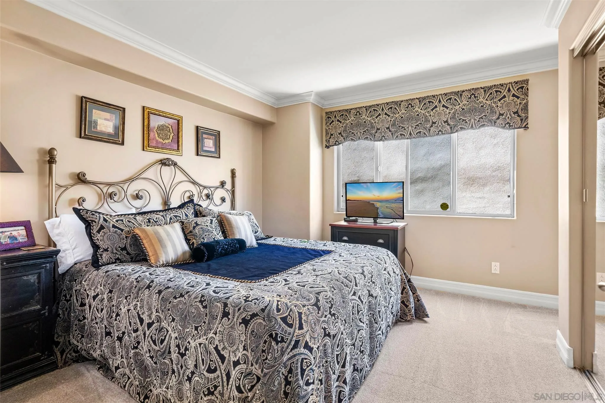 24 Sandpiper Strand Coronado, CA 92118 - Photo 30 of 55 a bedroom with a large bed and a window