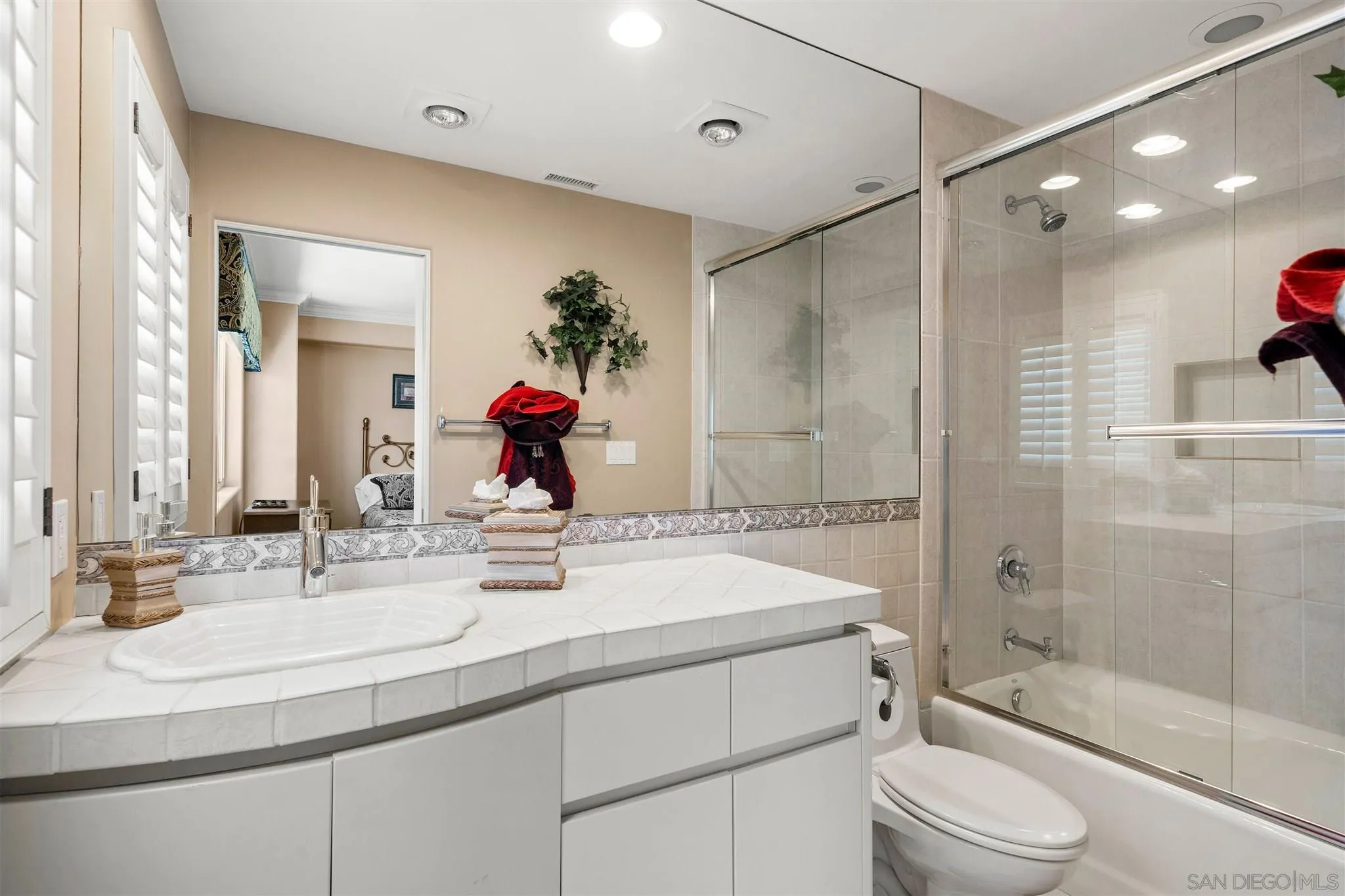 24 Sandpiper Strand Coronado, CA 92118 - Photo 31 of 55 a bathroom with a sink a toilet and shower