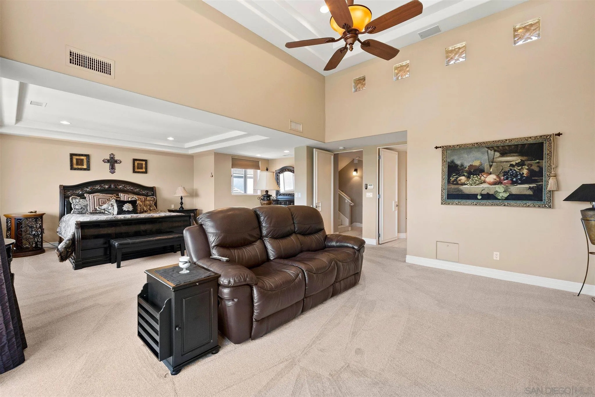 24 Sandpiper Strand Coronado, CA 92118 - Photo 34 of 55 a living room with furniture ceiling fan and a rug