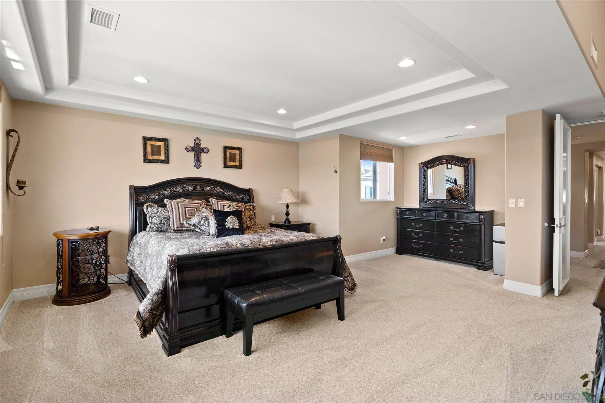 24 Sandpiper Strand Coronado, CA 92118 - Photo 37 of 55 a spacious bedroom with a bed and a television
