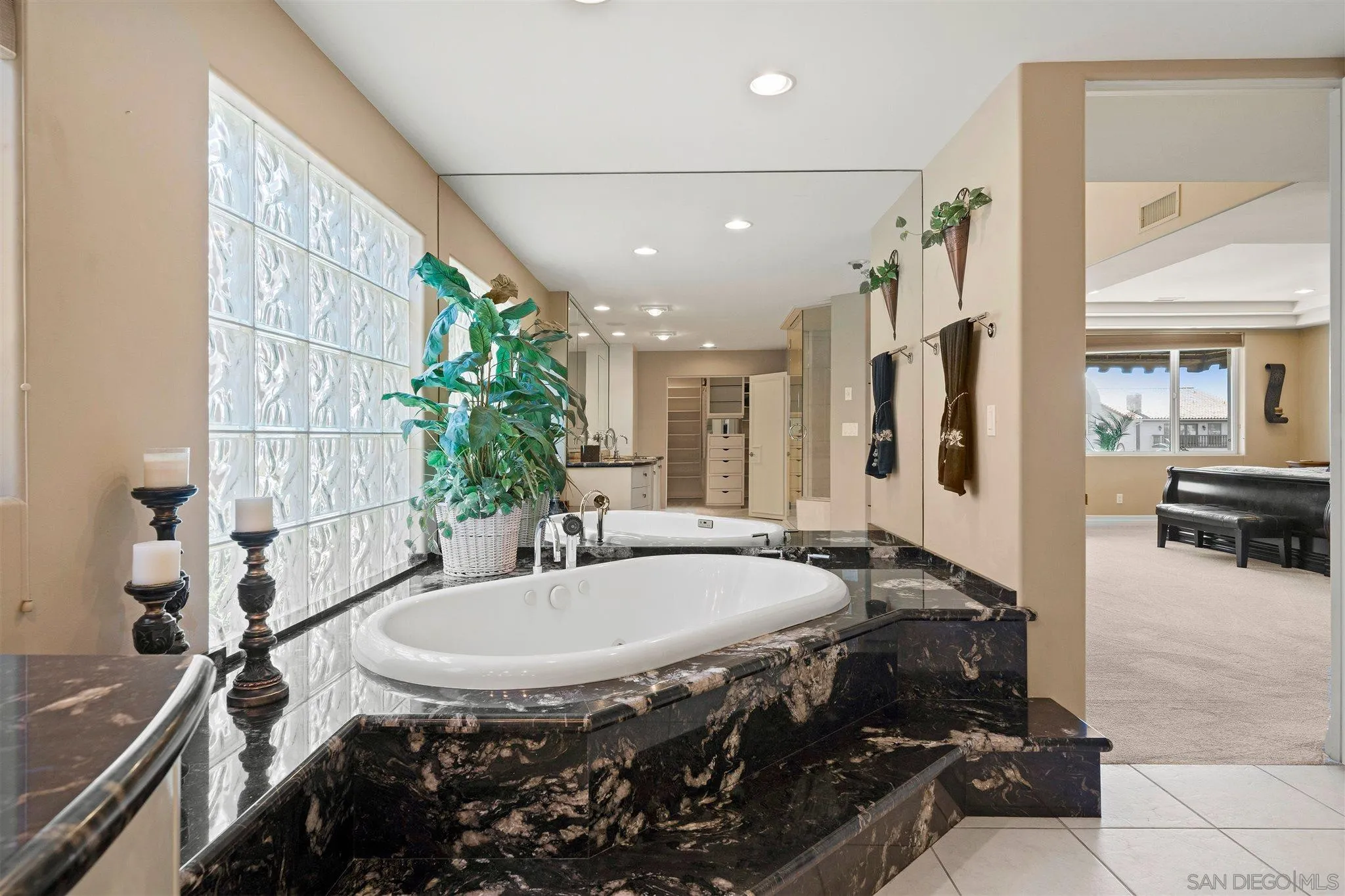 24 Sandpiper Strand Coronado, CA 92118 - Photo 40 of 55 a bathroom with a sink and a mirror