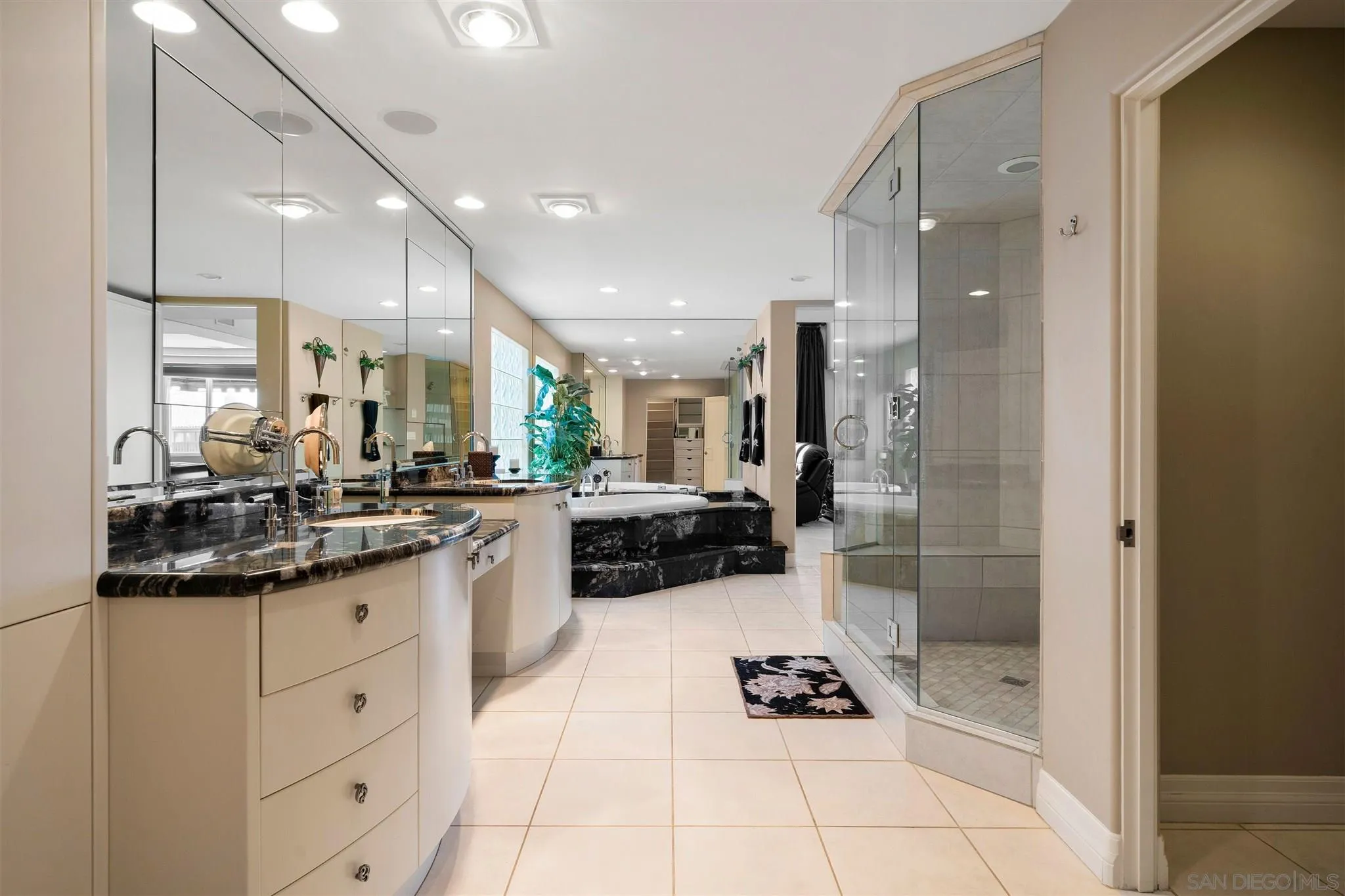24 Sandpiper Strand Coronado, CA 92118 - Photo 41 of 55 a kitchen with stainless steel appliances a sink a stove a refrigerator and cabinets