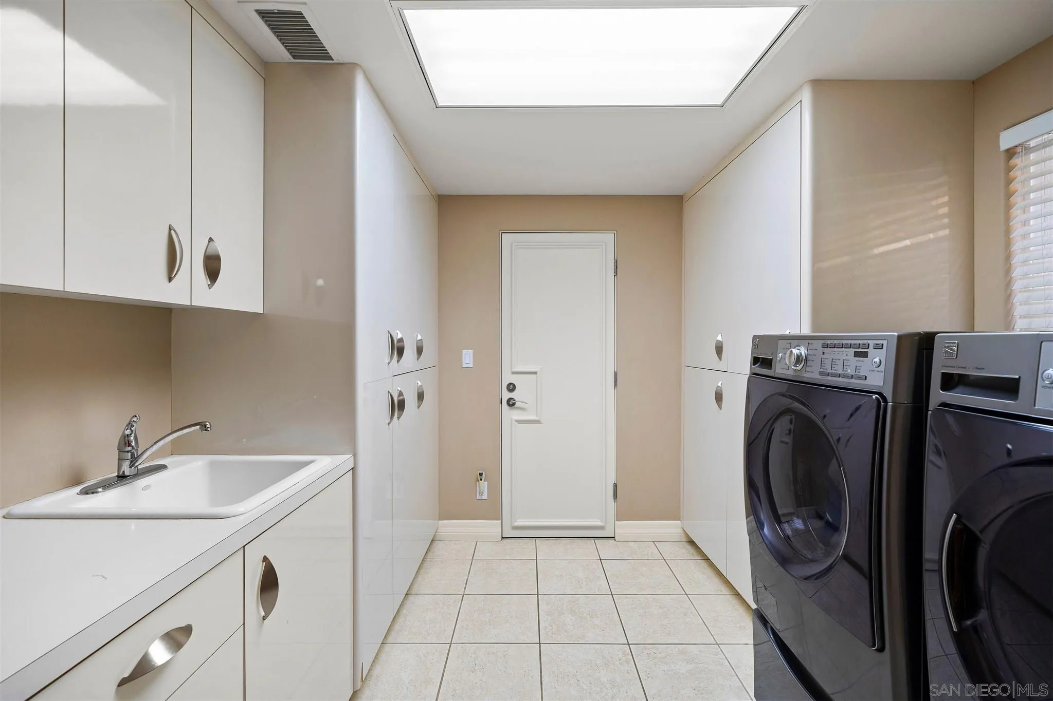 24 Sandpiper Strand Coronado, CA 92118 - Photo 55 of 55 a utility room with sink dryer and washer