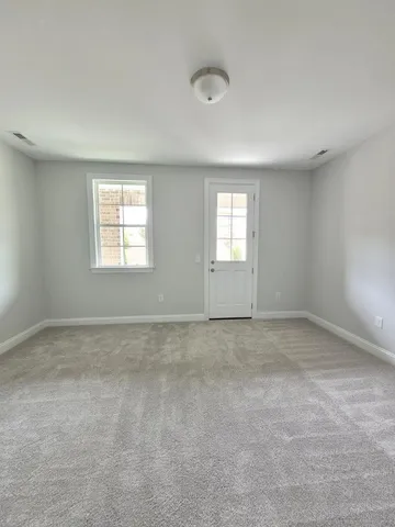 a bathroom with a sink a toilet a mirror and shower