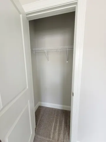 a view of an empty walk in closet