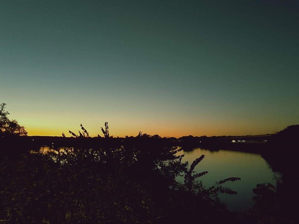 7028 Edgewater Trail Fort Worth, TX 76135 - Photo 4 of 12 a view of sunset