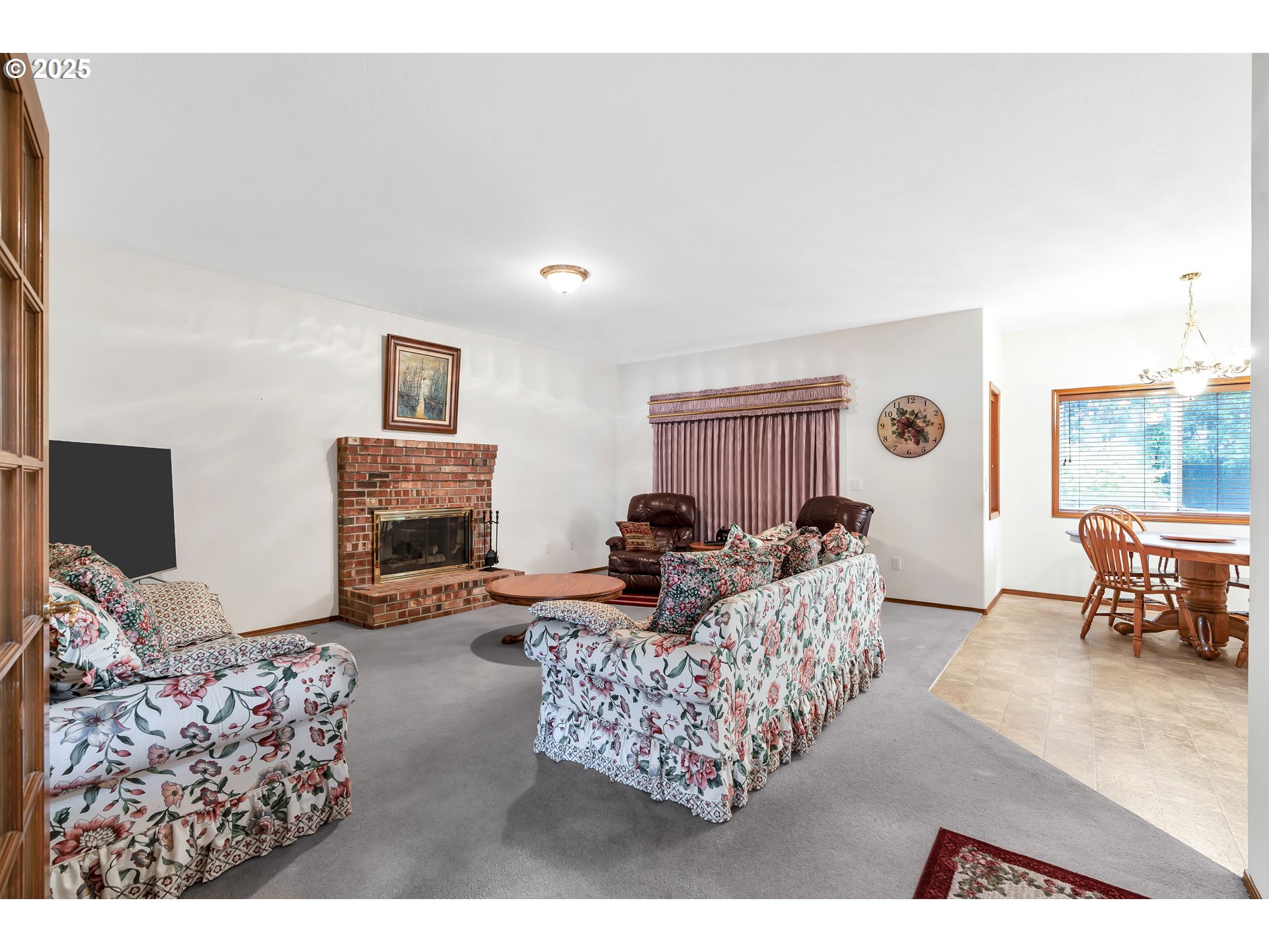 7829 Southwest 174th Place Beaverton, OR 97007 - Photo 11 of 45 a living room with furniture and a fireplace