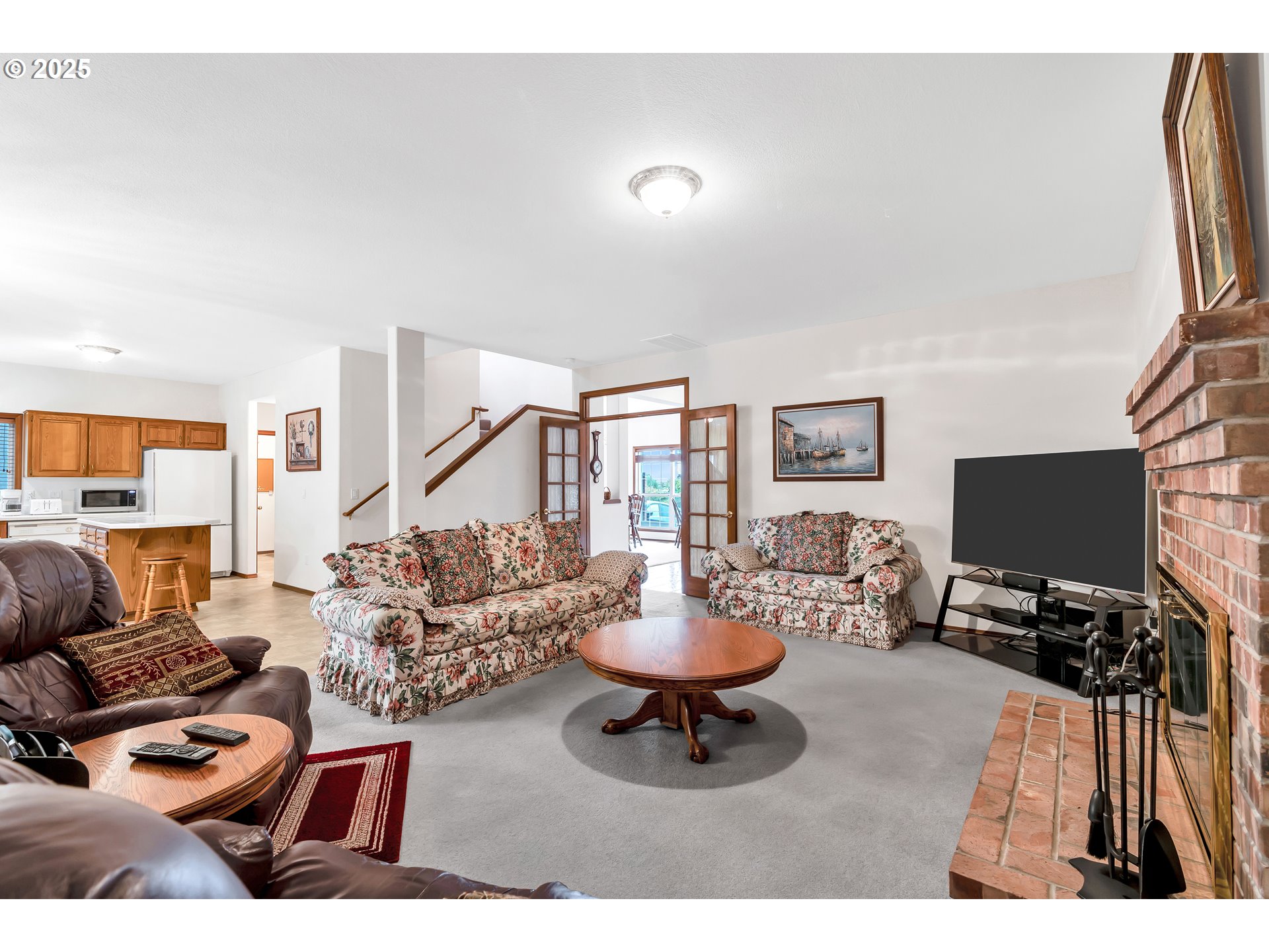 7829 Southwest 174th Place Beaverton, OR 97007 - Photo 13 of 45 a living room with furniture and a flat screen tv