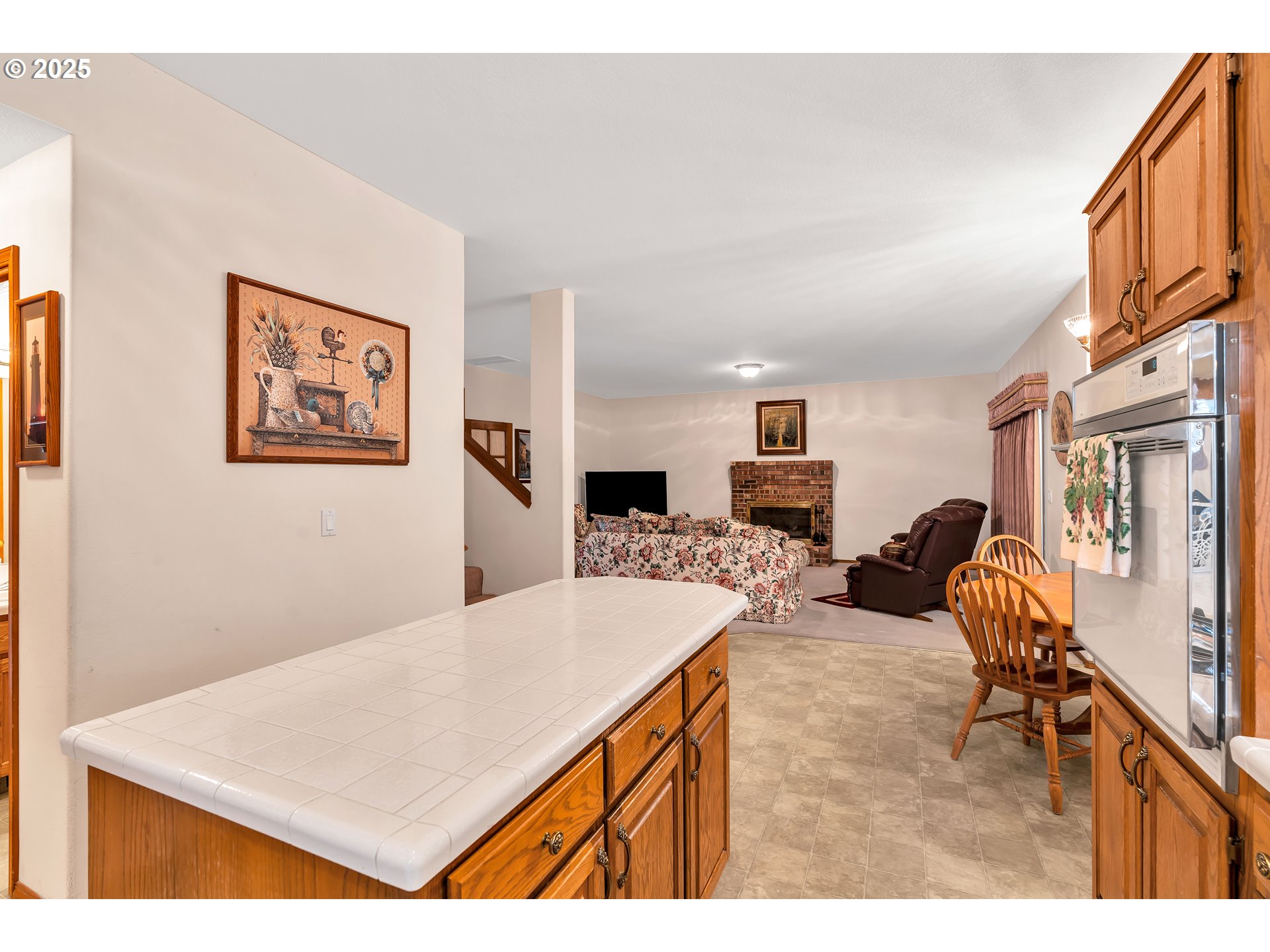 7829 Southwest 174th Place Beaverton, OR 97007 - Photo 18 of 45 a living room with furniture and a flat screen tv
