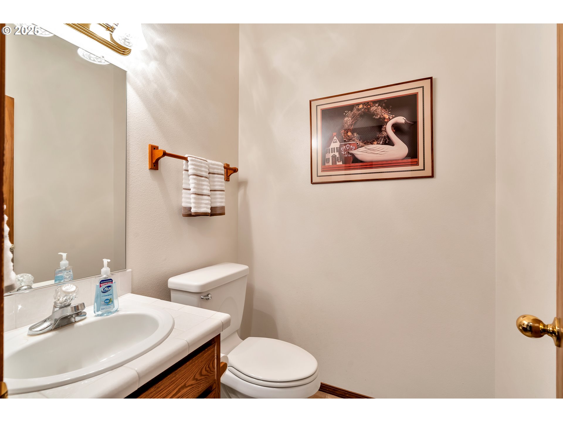 7829 Southwest 174th Place Beaverton, OR 97007 - Photo 19 of 45 a bathroom with a toilet a sink and mirror