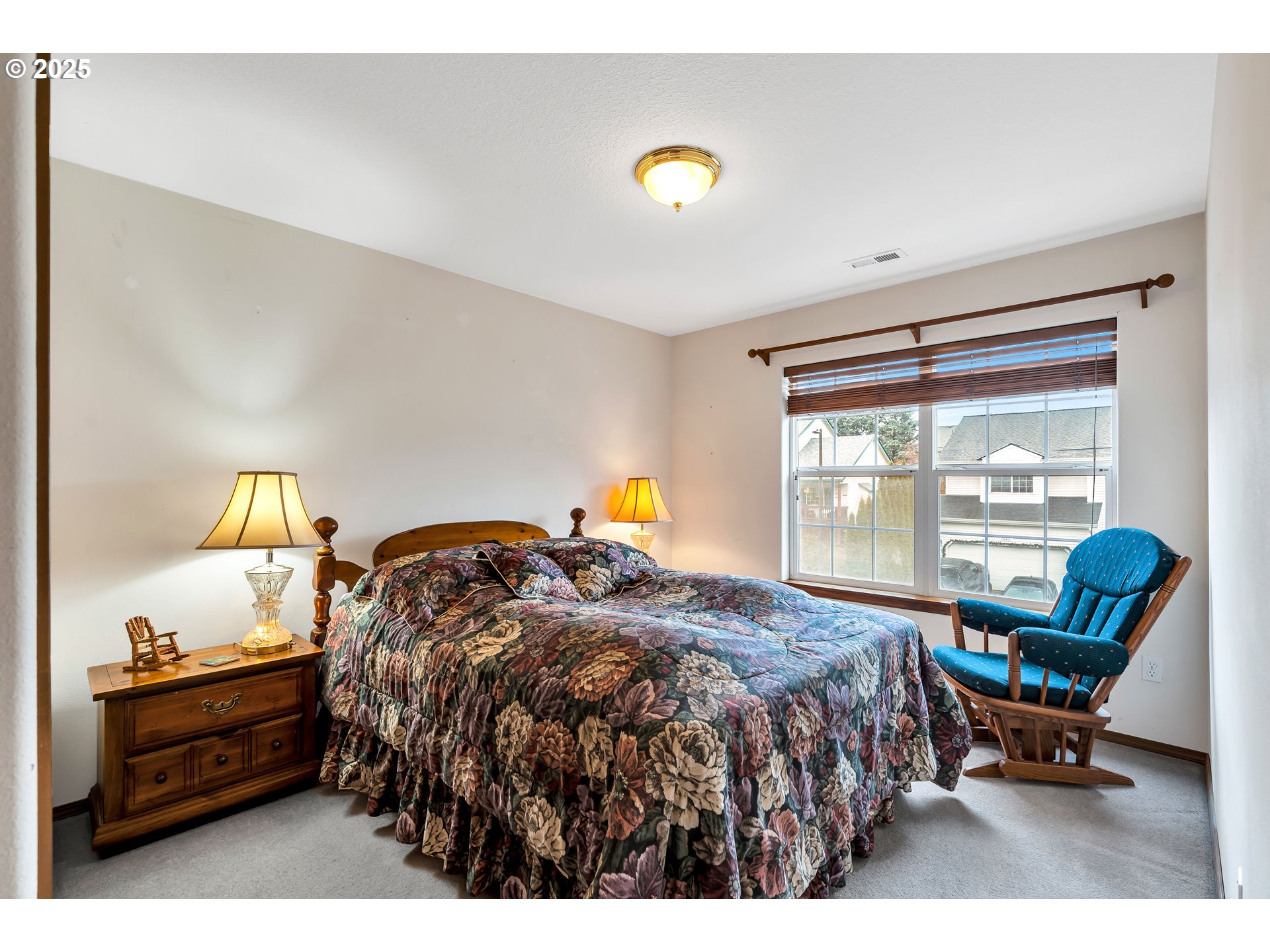 7829 Southwest 174th Place Beaverton, OR 97007 - Photo 21 of 45 a bedroom with a bed and a window