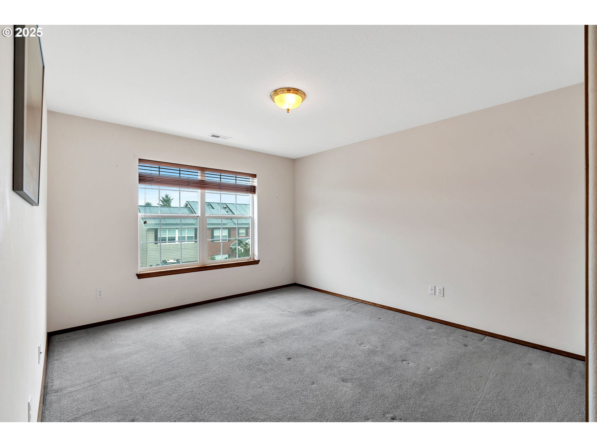7829 Southwest 174th Place Beaverton, OR 97007 - Photo 24 of 45 a view of an empty room with a window