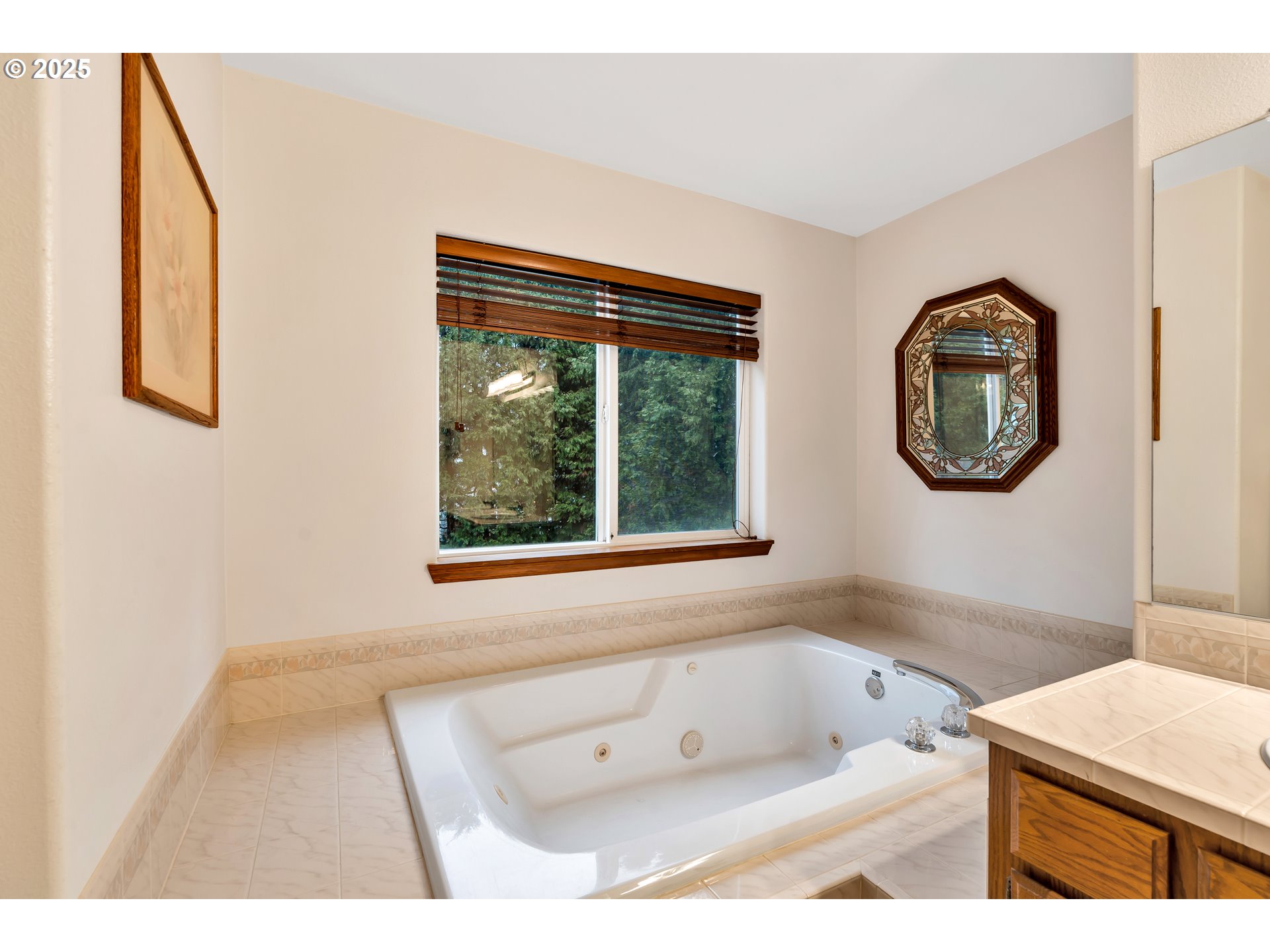 7829 Southwest 174th Place Beaverton, OR 97007 - Photo 33 of 45 a bathroom with a tub sink and mirror