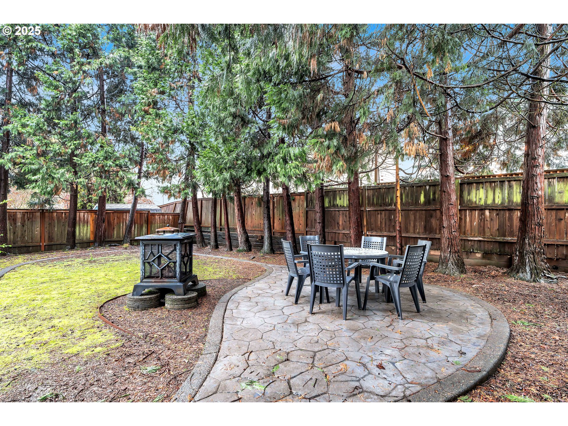 7829 Southwest 174th Place Beaverton, OR 97007 - Photo 42 of 45 a view of a backyard with table and chairs