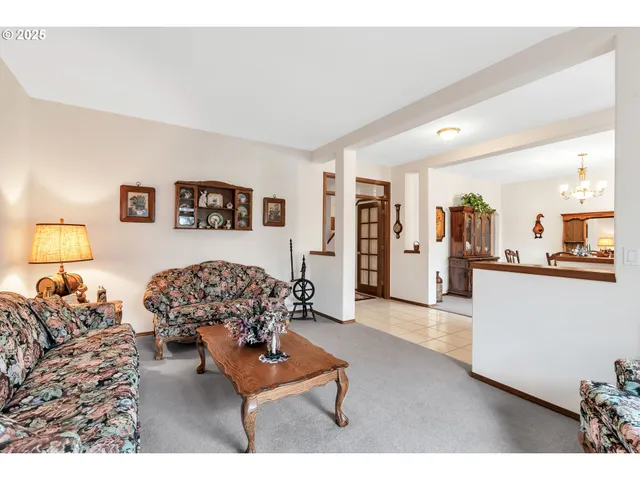 a living room with furniture and a table