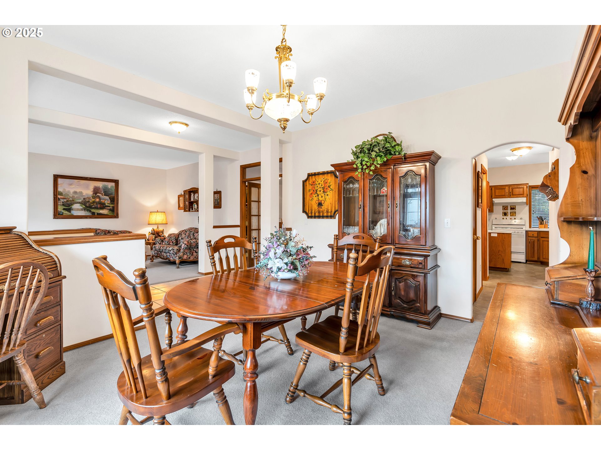 7829 Southwest 174th Place Beaverton, OR 97007 - Photo 10 of 45 a view of a dining room with furniture and chandelier