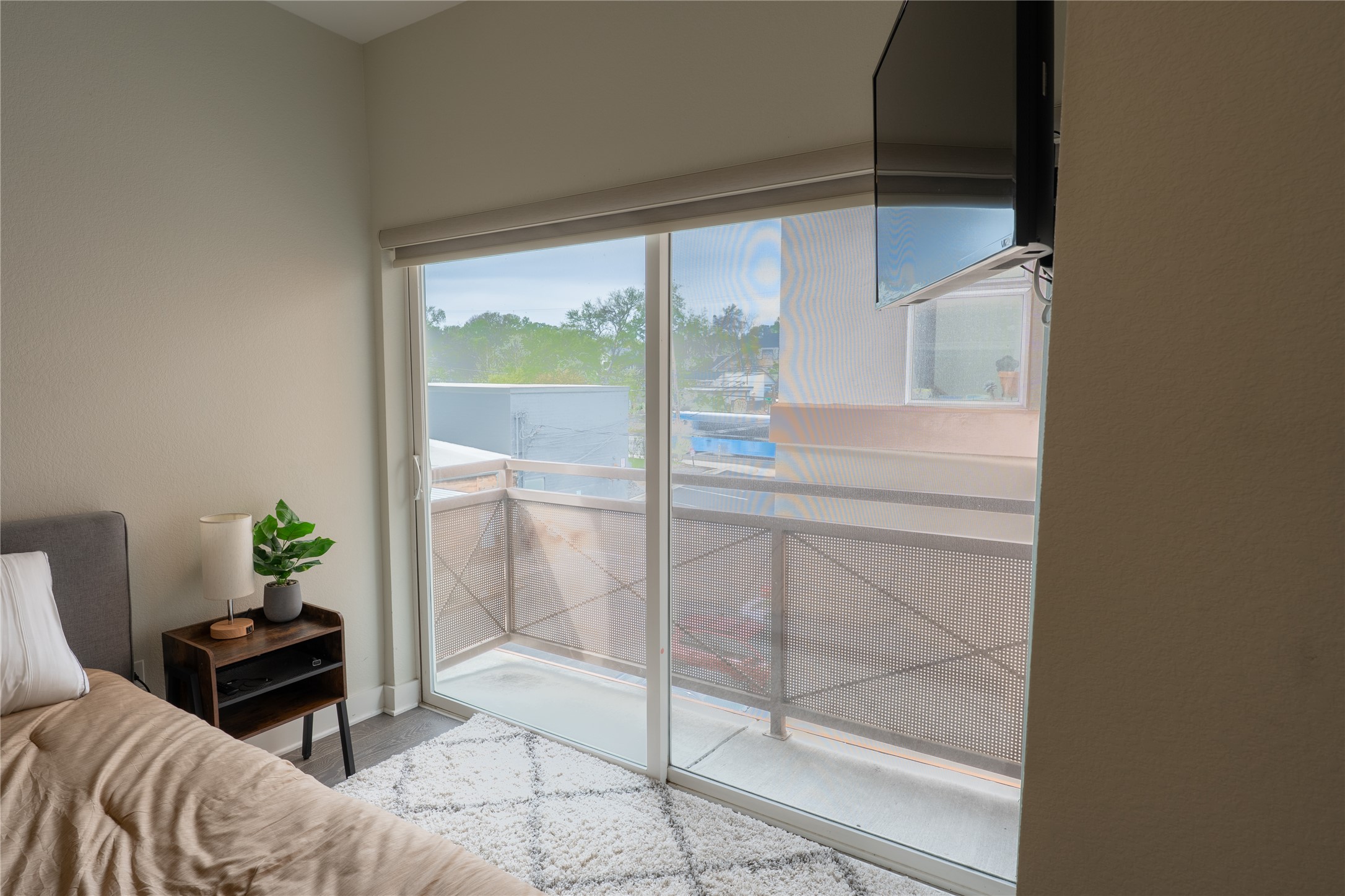 2827 Manor Road, Unit 4101 Austin, TX 78722 - Photo 23 of 38 This room features a sliding glass door providing access to a private balcony, offering outdoor space