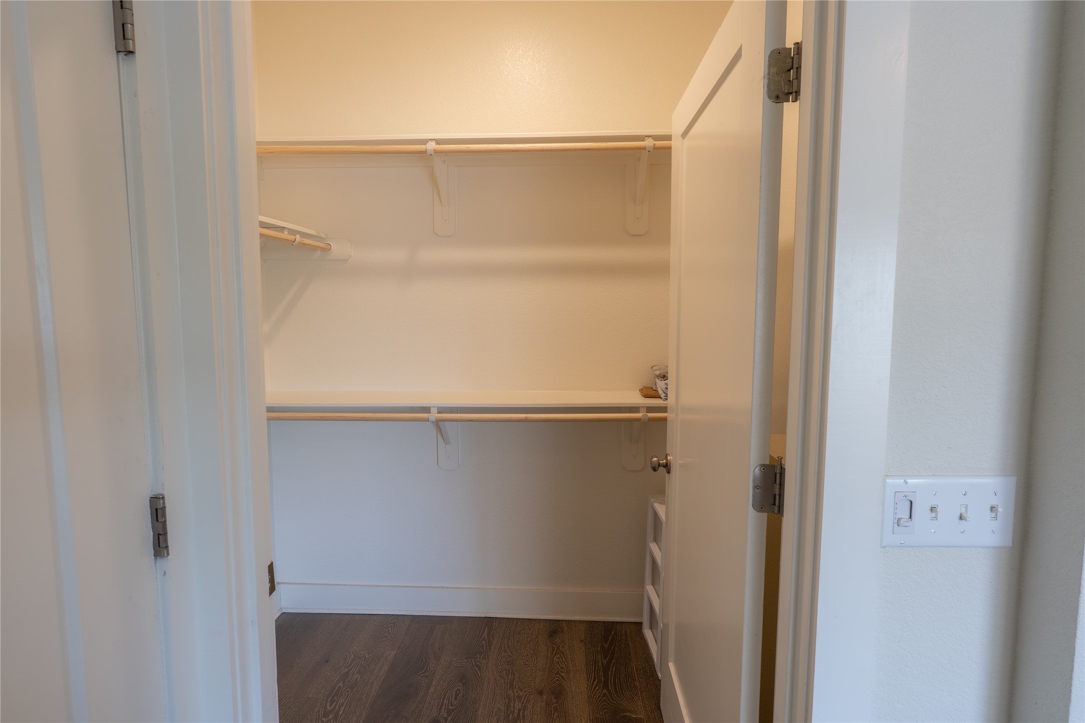 2827 Manor Road, Unit 4101 Austin, TX 78722 - Photo 27 of 38 The closet features shelving and hanging rods, providing ample storage space