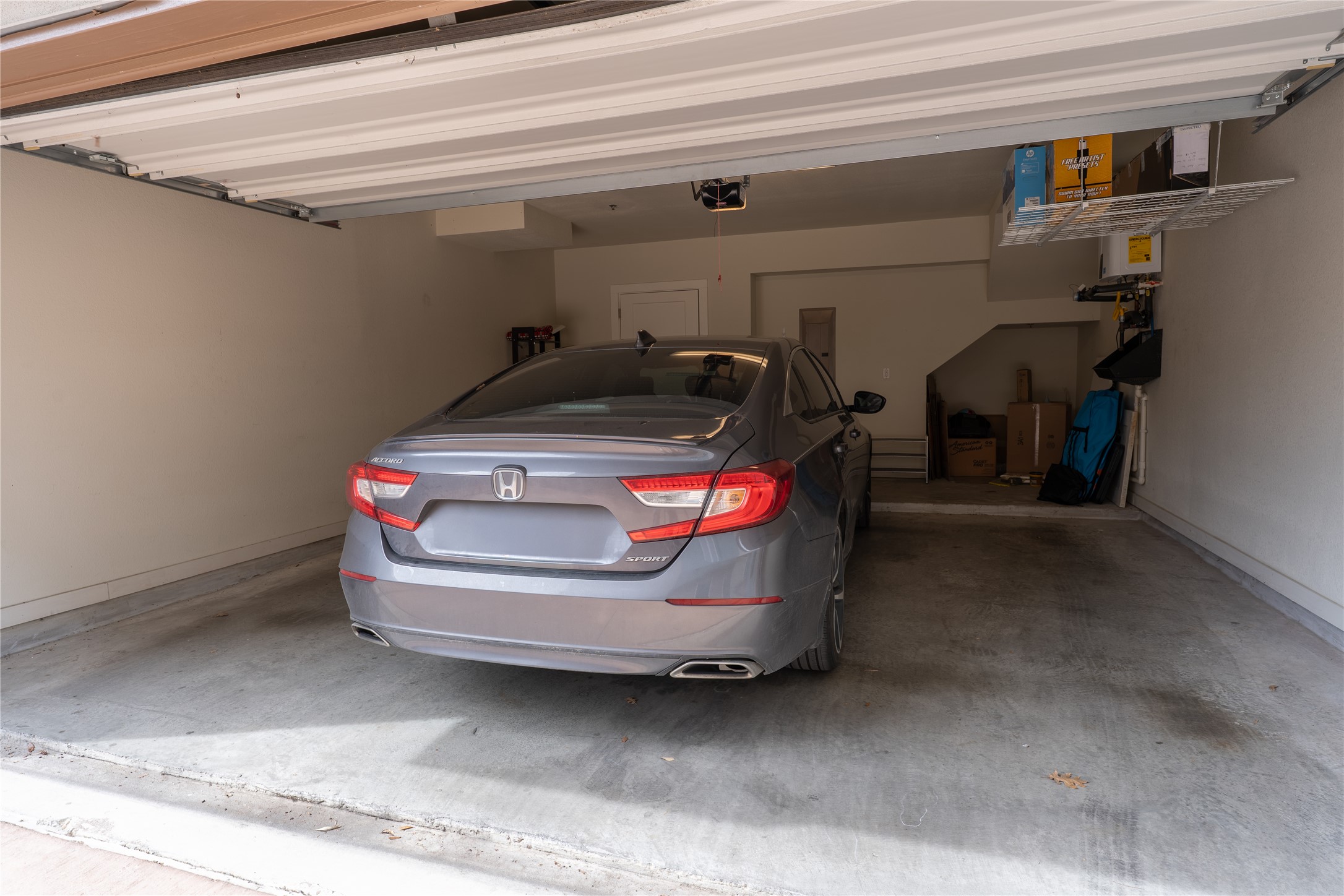 2827 Manor Road, Unit 4101 Austin, TX 78722 - Photo 37 of 38 The property features a garage with a concrete floor and a white ceiling