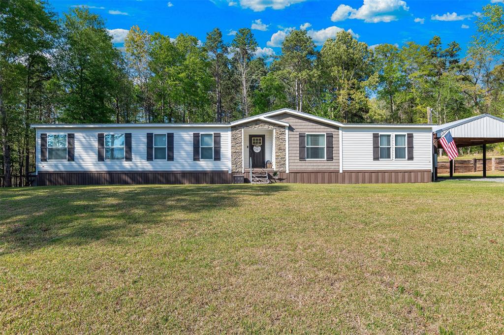 339 Cycle Plant Road Benton, LA 71006 - Photo 1 of 25 a front view of house with yard and trees in the background