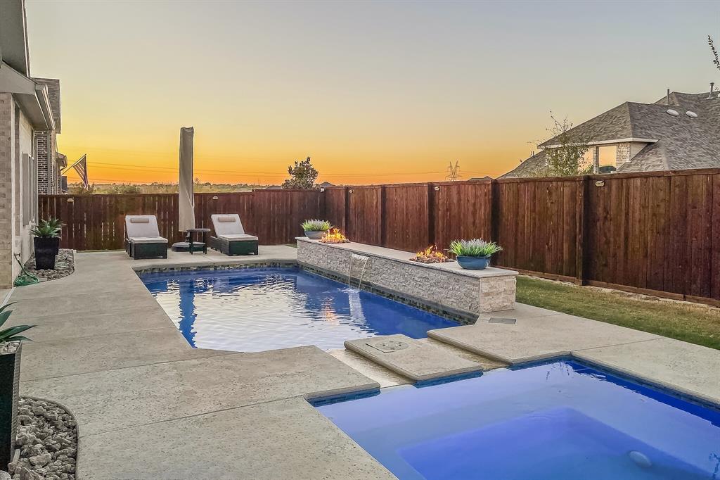 a view of a terrace with furniture and a fire pit