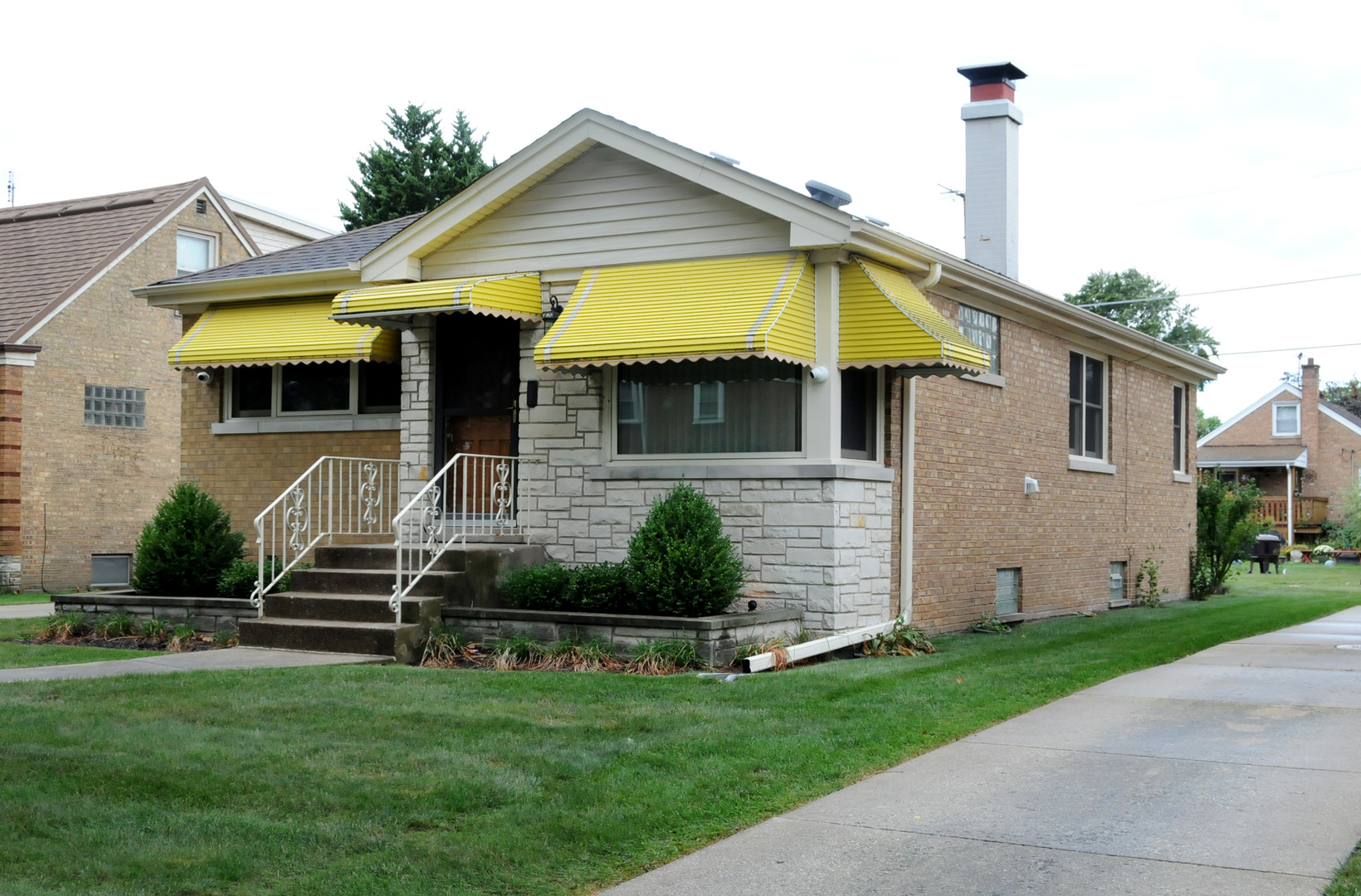 2436 2nd Avenue North Riverside, IL 60546 - Photo 1 of 26 a front view of a house with a garden and plants